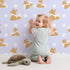 Lovely child standing in front of Whimsy Tots Polka Pals Fox Wallpaper in Lavender Mist with fox, polka dot, tail, animal in design. Lovely child standing in front of Whimsy Tots Polka Pals Fox Wallpaper in Lavender Mist with fox, polka dot, tail, animal in design.