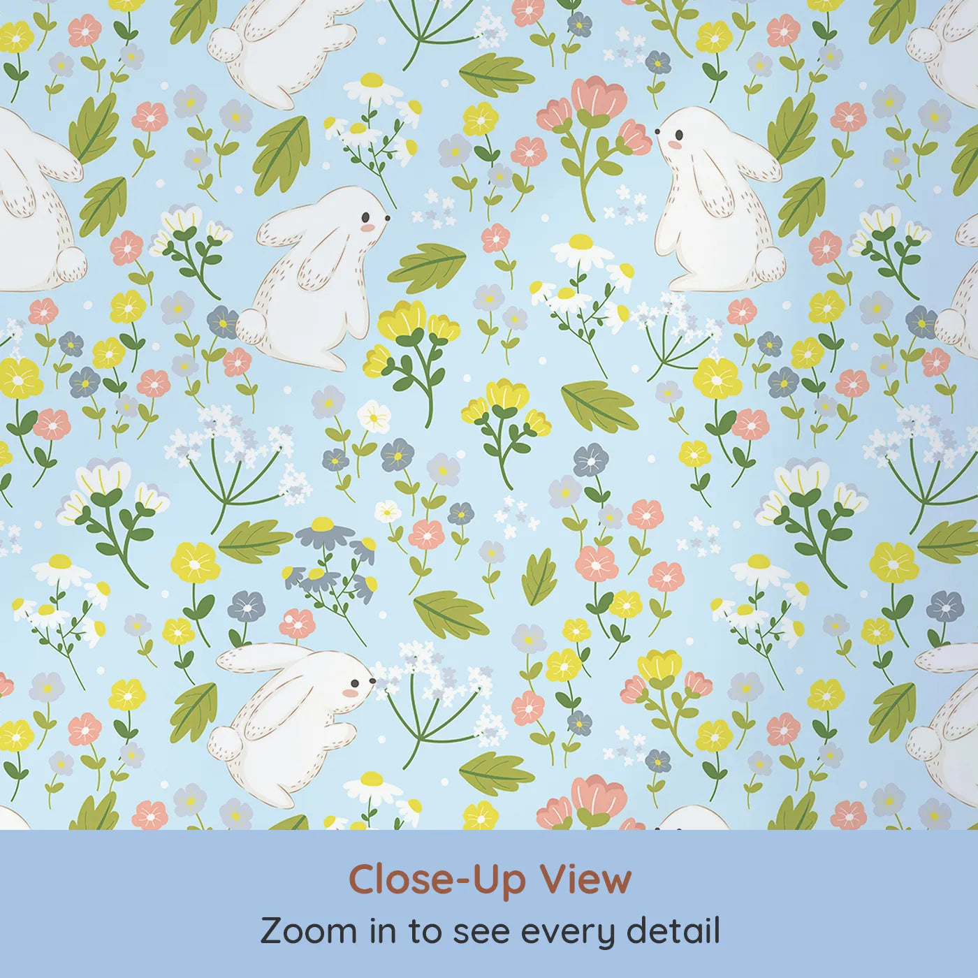 Close-up view of Whimsy Tots' Bloomy Bunny Meadow Wallpaper in Bluebell Sky (W3061D).Fluffy white bunnies play among wildflowers on a bright blue sky.