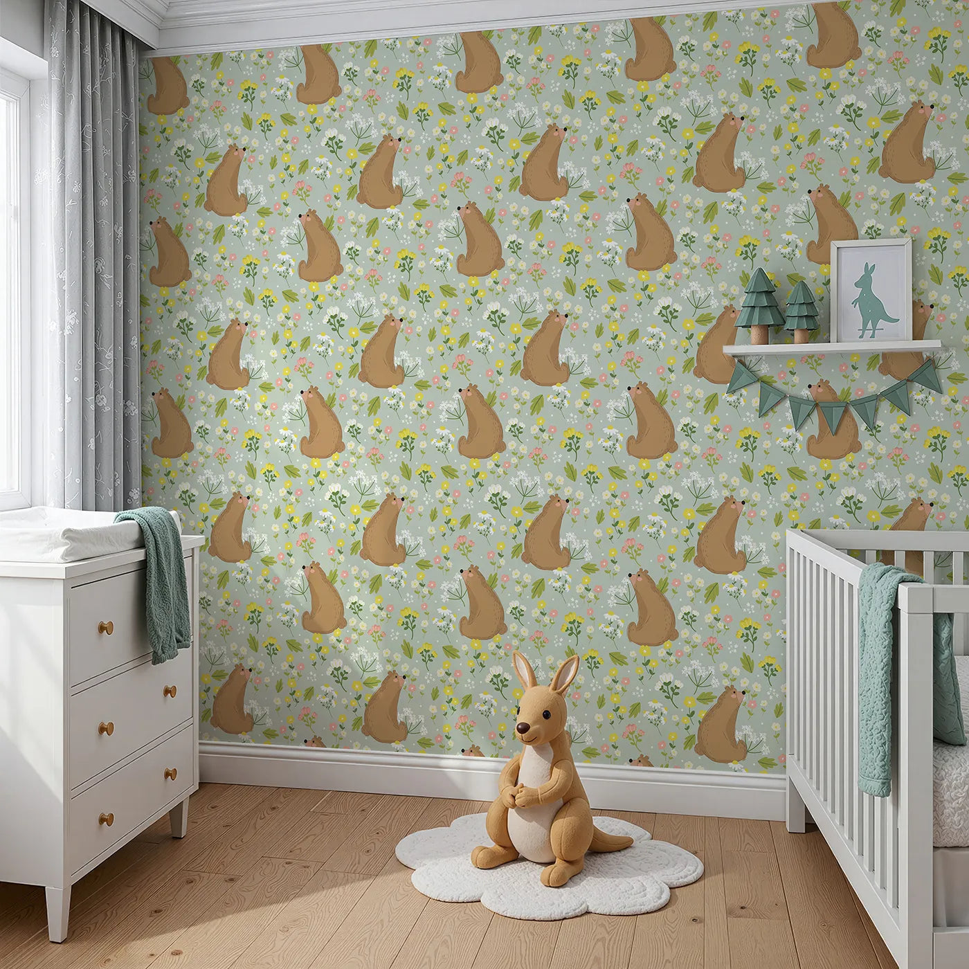 Angled view of Whimsy Tots' Blossom Bear Meadow Wallpaper in Soft Sage Green (W3062C).Woodland bears and meadow blooms rest upon a gentle sage green field.