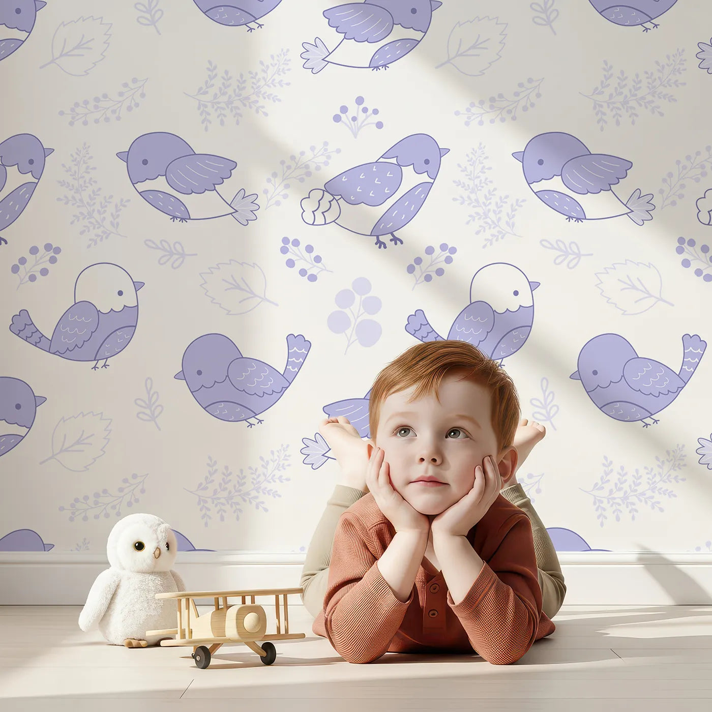 Lovely child standing in front of Whimsy Tots Tweetheart Meadow Wallpaper in Purple with bird, leaf, flower, berry in design.