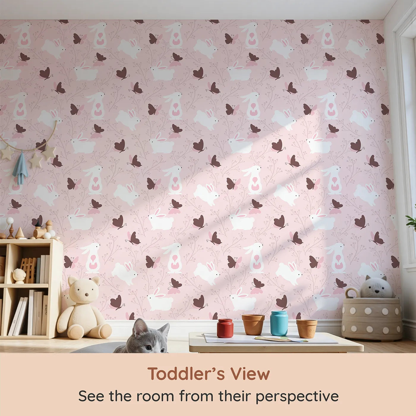 Whimsy Tots Bunny and Butterfly Meadow Wallpaper in Blush Pink (W3074C) from your child's view.White bunnies and chocolate butterflies dance through a rosy pink garden.