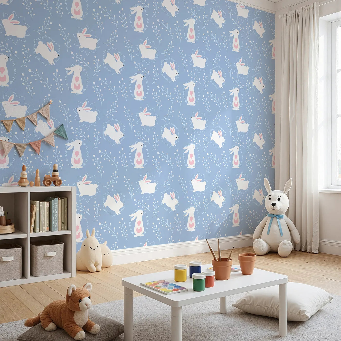 Angled view of Whimsy Tots' Tribal Bunny Sprigs Wallpaper in Sky Blue (W3075D).White rabbits hop across blue skies framed by tribal shapes and forest sprigs.