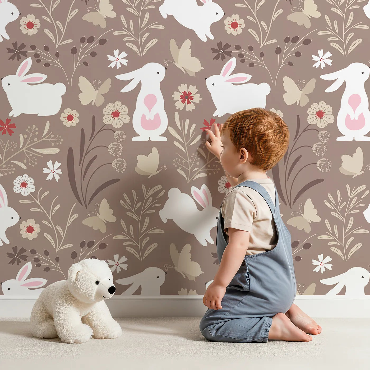 Lovely child standing in front of Whimsy Tots Wild Meadow Bunny Garden Wallpaper in Cocoa with rabbit, bunny, butterfly, flower, sprig in design.
