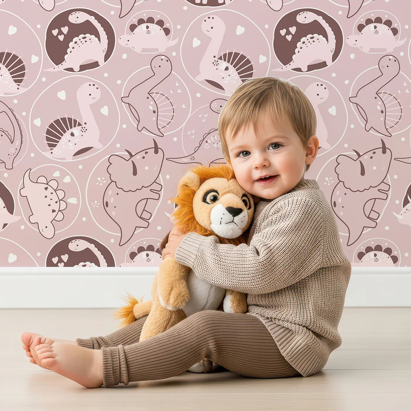 Lovely child standing in front of Whimsy Tots Dino Circle Parade Wallpaper in Blush Pink with dinosaur, flower, heart, circle in design.
