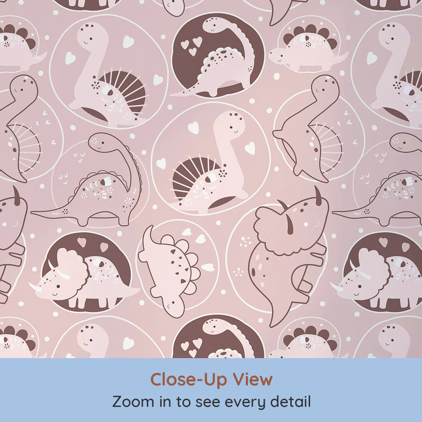 Close-up view of Whimsy Tots' Dino Circle Parade Wallpaper in Blush Pink (W3079B).Sweet pink dinosaurs twirl in hearts and blossoms across a soft rosey field.
