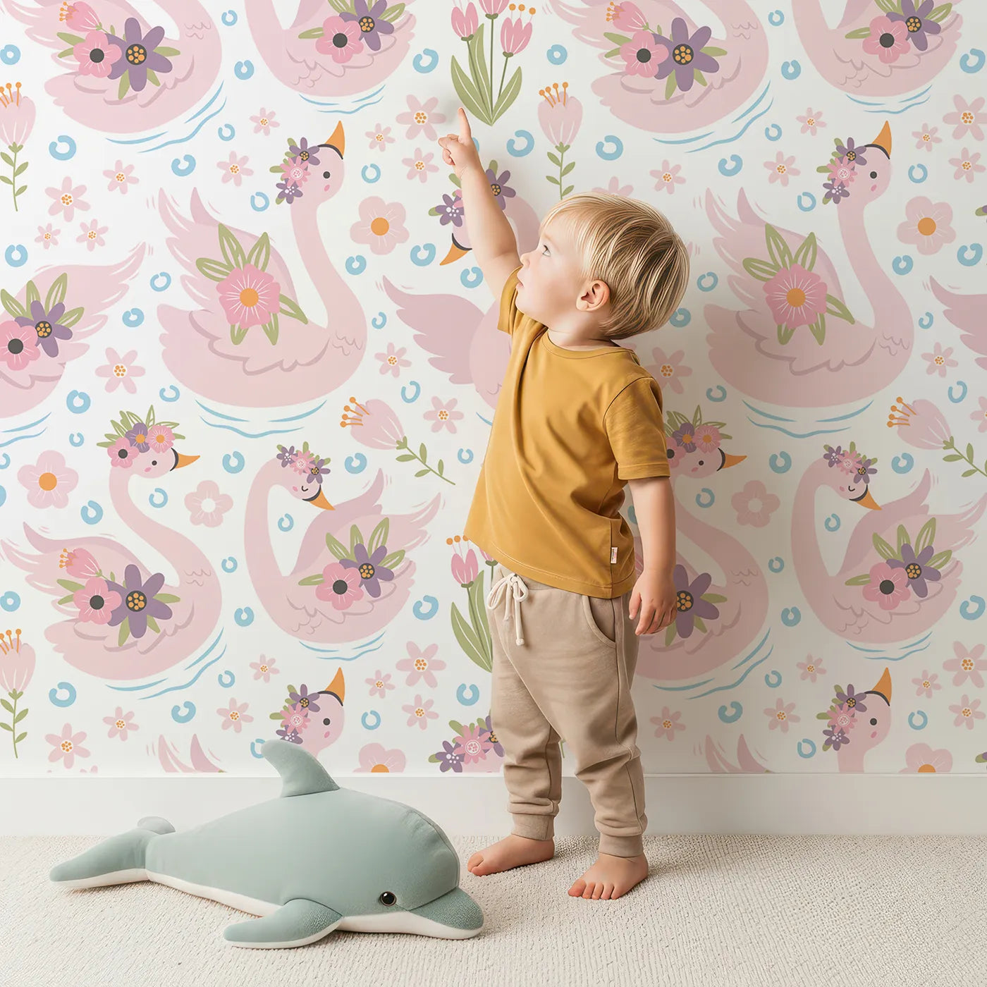 Lovely child standing in front of Whimsy Tots Blooming Swan Garden Wallpaper in White with swan, flower, crown, tulip, ripple in design.
