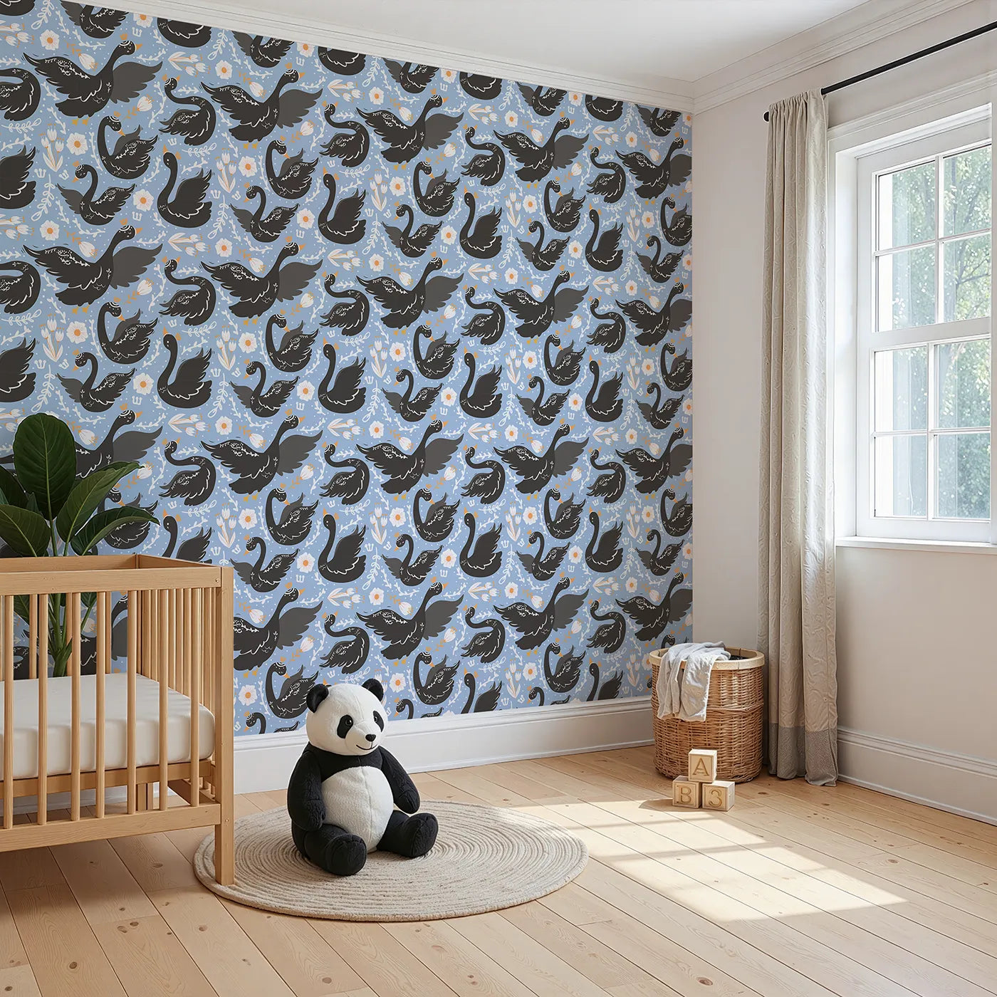 Angled view of Whimsy Tots' Regal Swan Parade Wallpaper in Sky Blue (W3087B).Crowned black swans flutter among blooms on a cheerful sky-blue canvas.