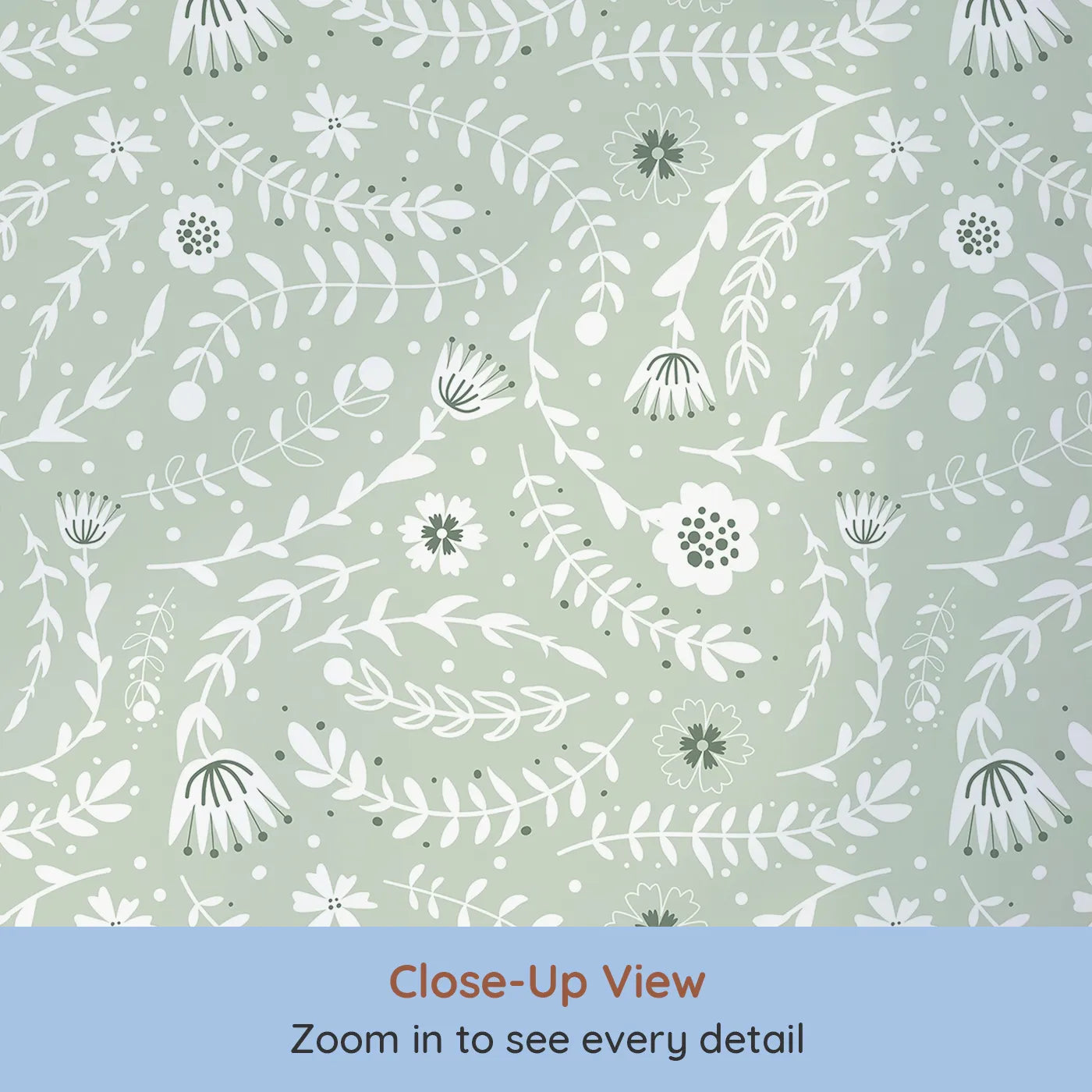 Close-up view of Whimsy Tots' Spring Meadow Whispers Wallpaper in Sage Green (W3089B).Dainty flowers and curving leaves drift across a soft sage field.