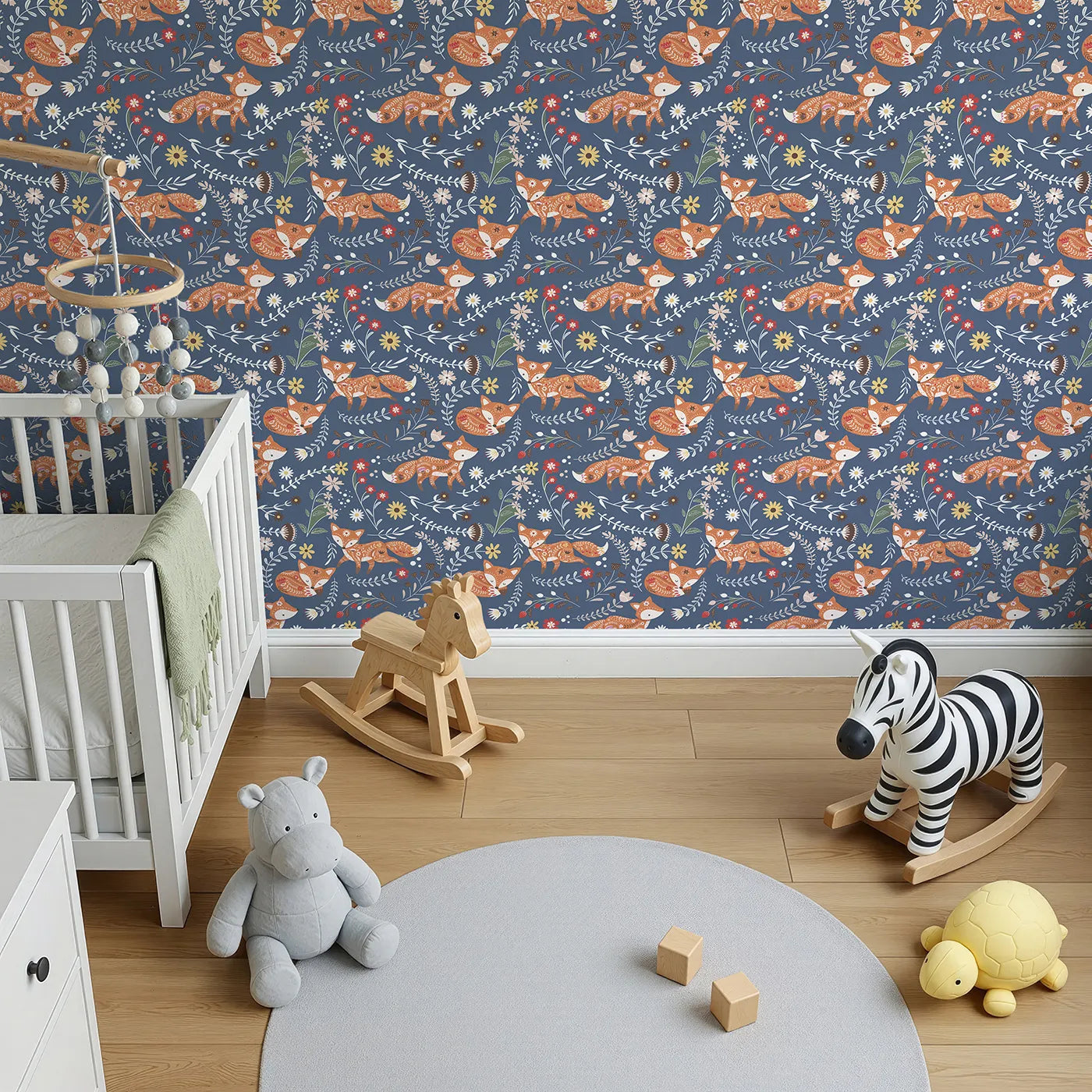 Top-Down view of Whimsy Tots' Folk Bloom Foxes Wallpaper in Twilight Blue (W3096D).Playful foxes and twirling florals glow on a twilight blue field.