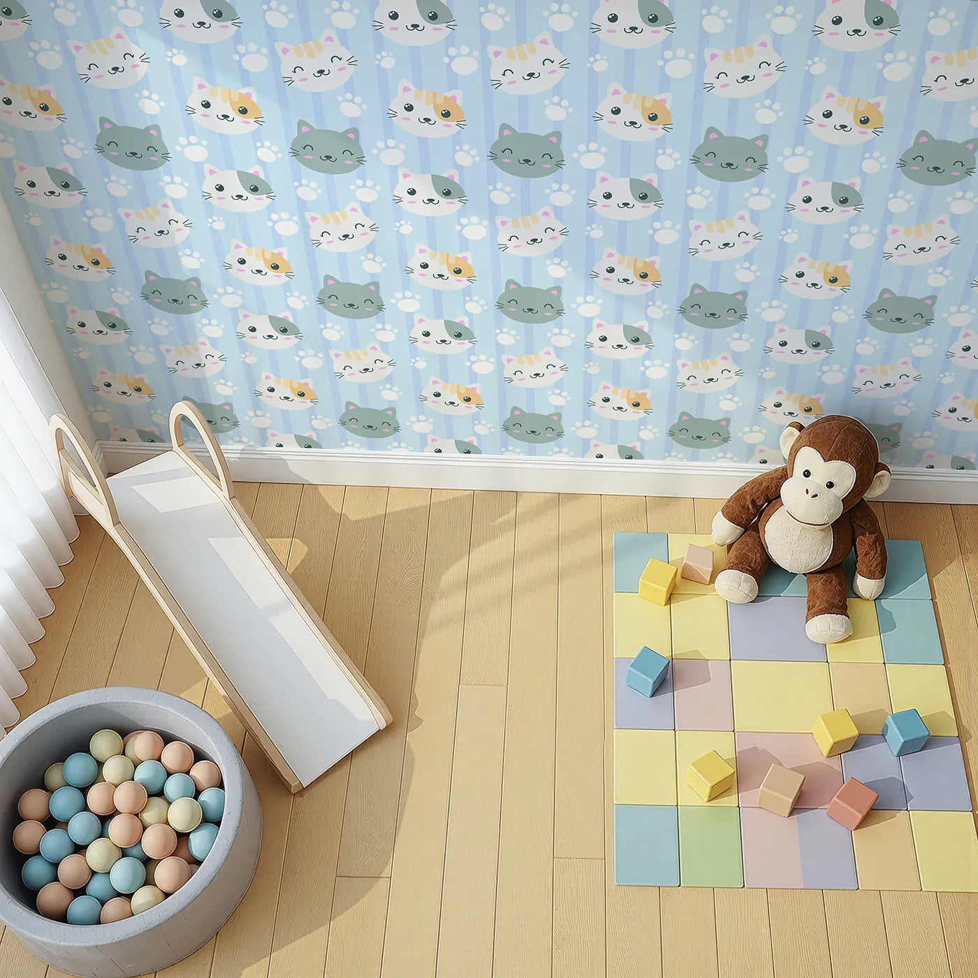 Top-Down view of Whimsy Tots' Pawprint Kitty Parade Wallpaper in Baby Blue (W3098D).Smiley kittens and snowy pawprints bounce across soft blue stripes.
