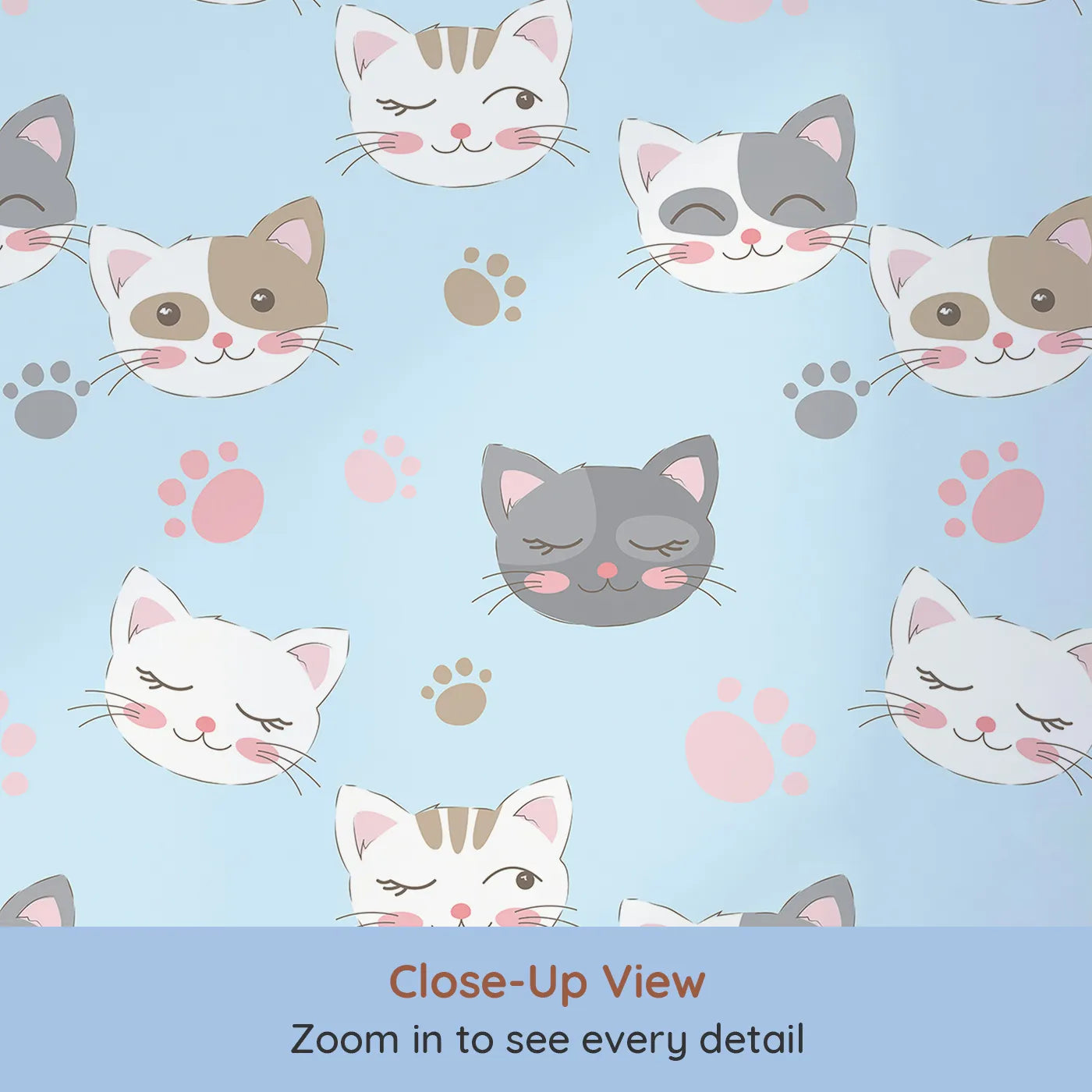 Close-up view of Whimsy Tots' Whisker Wink Kitty Wallpaper in Sky Blue (W3101D).Cheeky cat faces and pawprints spark playful grins.