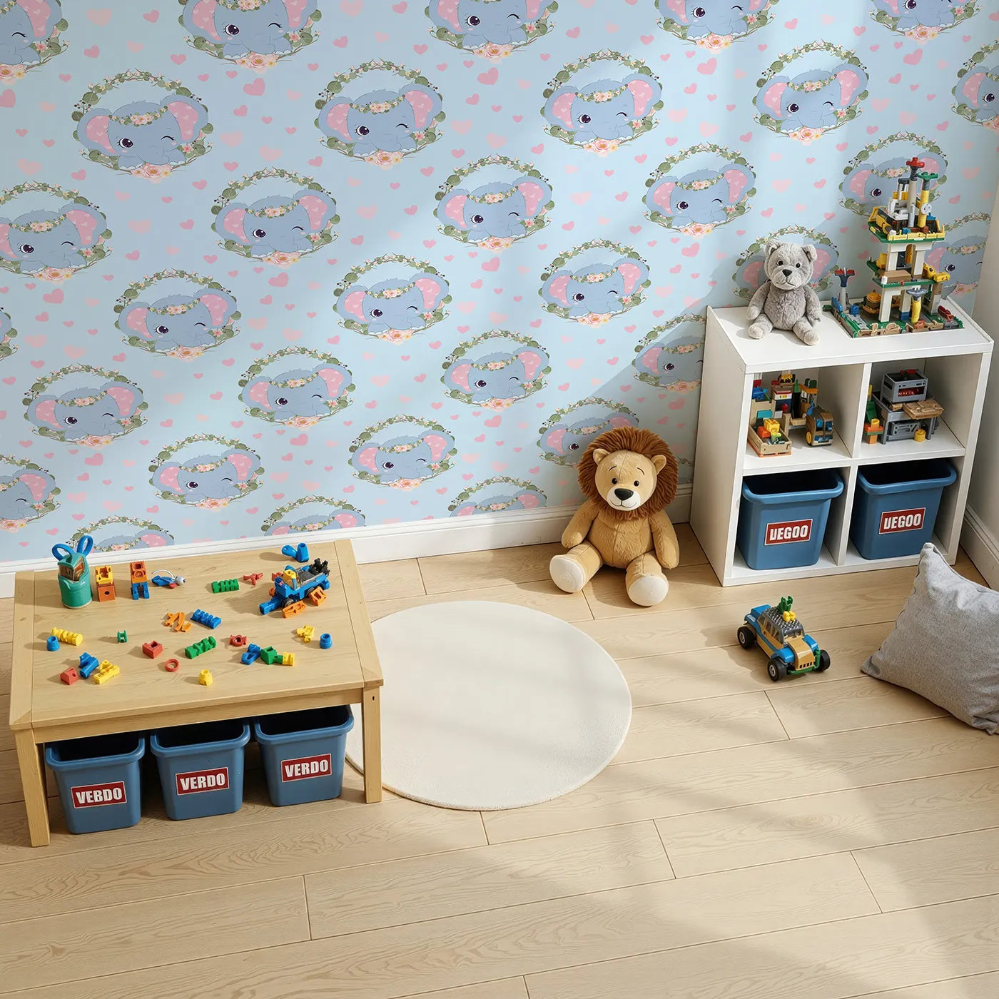 Top-Down view of Whimsy Tots' Floral Elephant Wink Wallpaper in Sky Blue (W3107D).Blue skies, pink hearts, and playful trunks bring smiles all around.