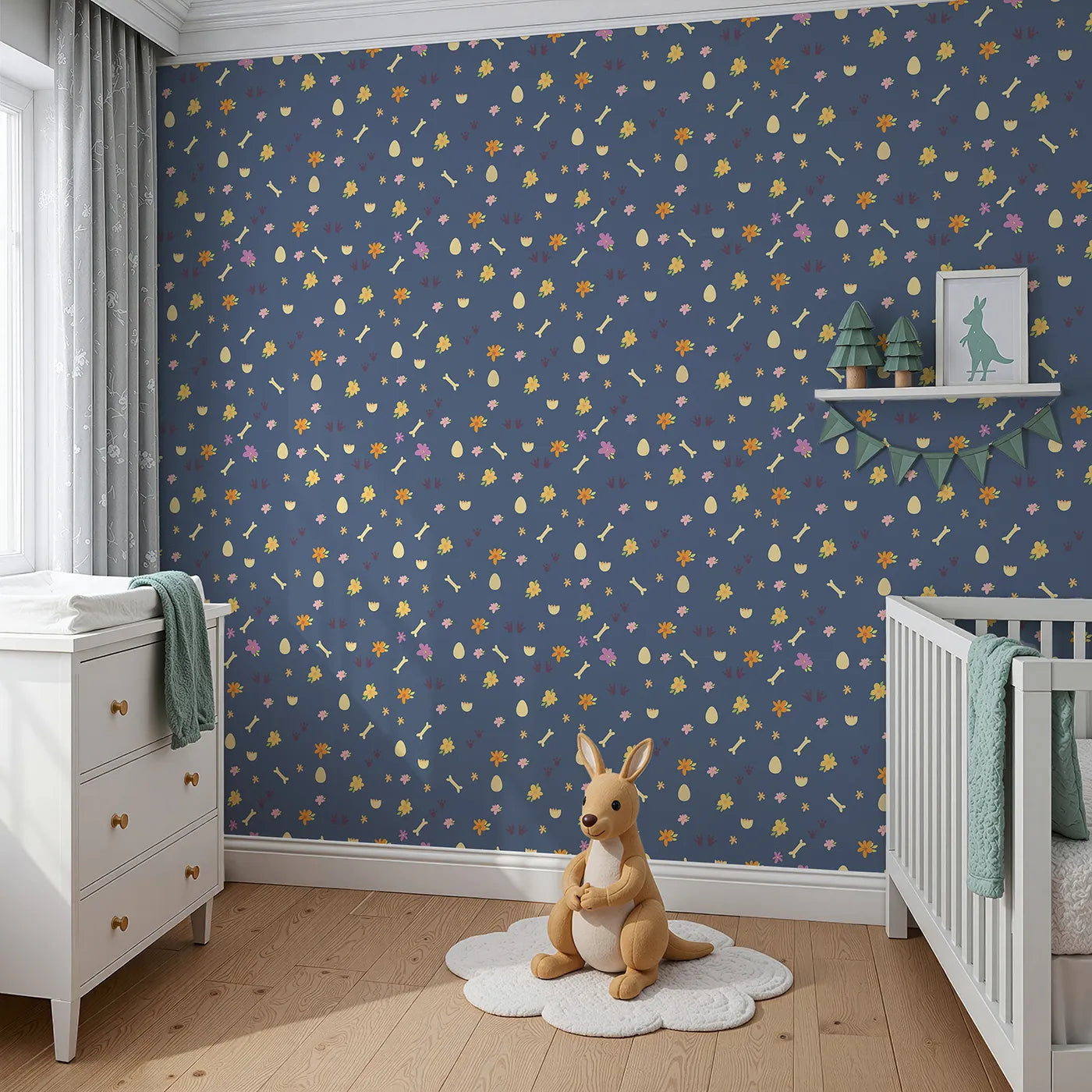 Angled view of Whimsy Tots' Dino Hatch Trail Wallpaper in Dusty Denim (W3118B).Tiny tracks and bones wander across a denim blue field of dreams.