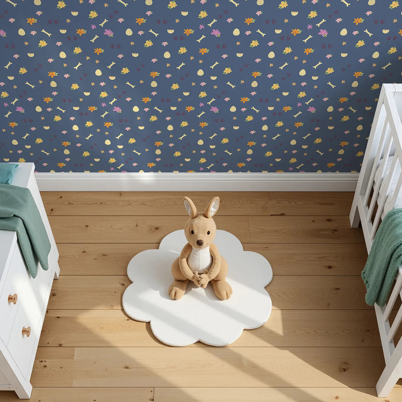 Top-Down view of Whimsy Tots' Dino Hatch Trail Wallpaper in Dusty Denim (W3118B).Tiny tracks and bones wander across a denim blue field of dreams.