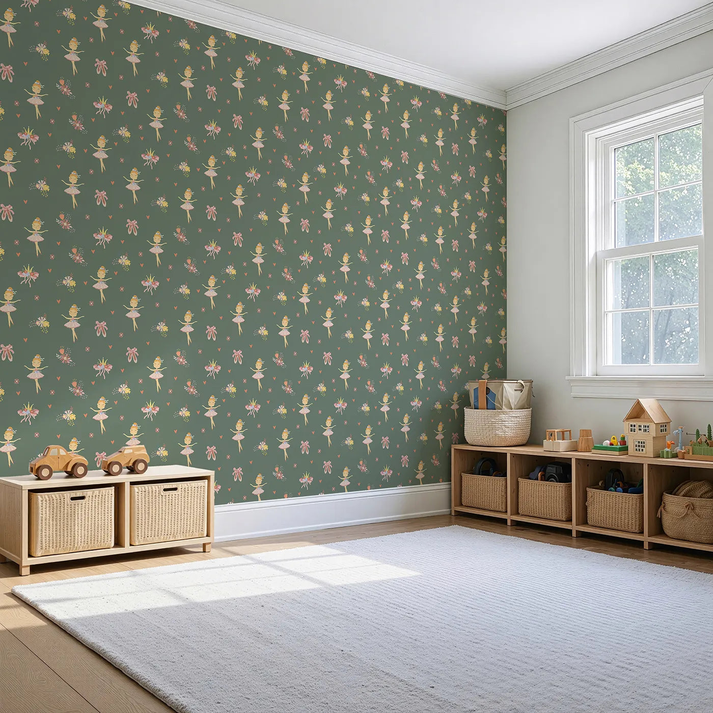 Angled view of Whimsy Tots' Blush Ballerina Dreams Wallpaper in Forest Waltz Green (W3124B).Tutus and crowns pirouette across a soft mossy green scene.