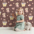 Lovely child standing in front of Whimsy Tots Ballet Mouse Garden Wallpaper in Cocoa Blossom Brown with mouse, flower, bow, basket in design. Lovely child standing in front of Whimsy Tots Ballet Mouse Garden Wallpaper in Cocoa Blossom Brown with mouse, flower, bow, basket in design.
