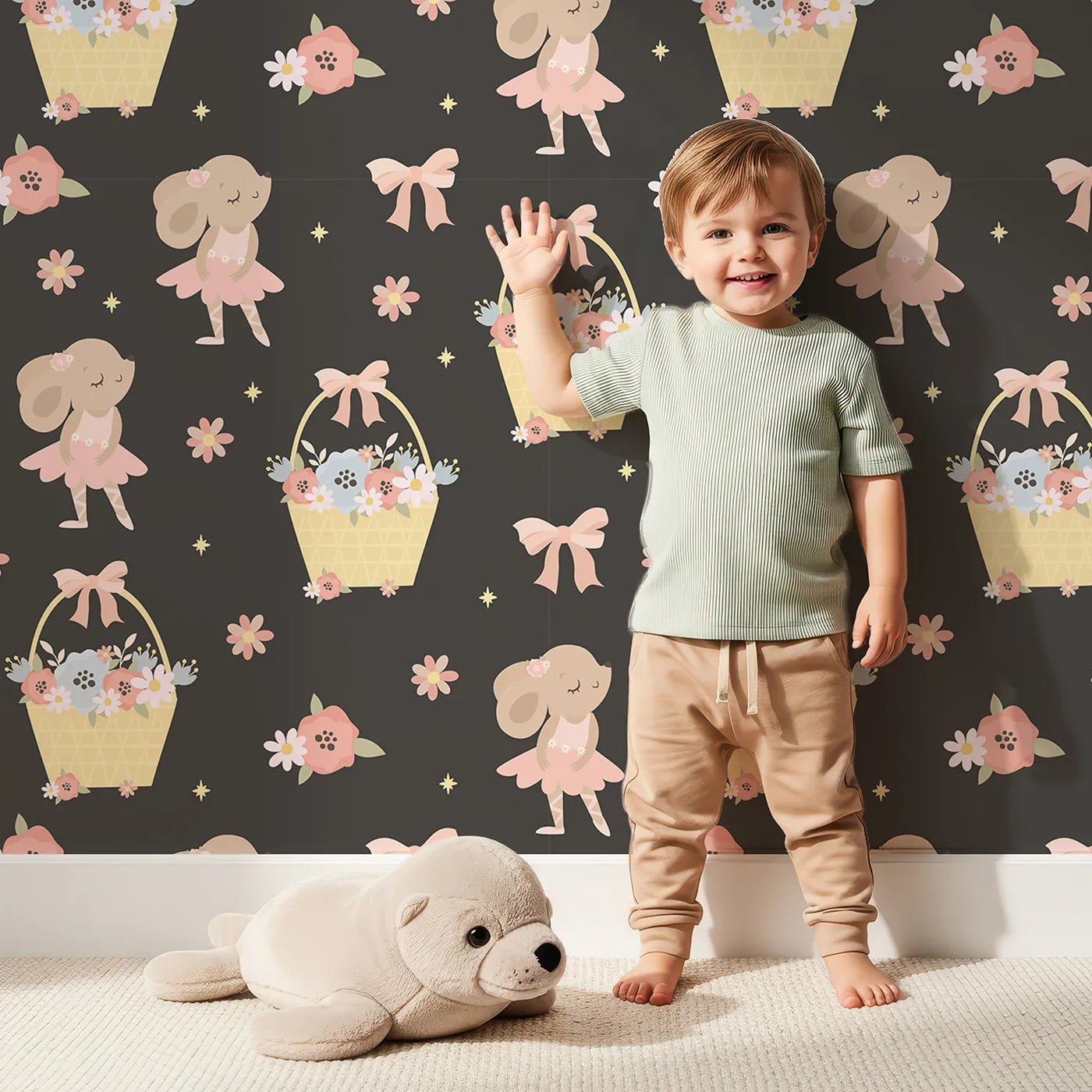 Lovely child standing in front of Whimsy Tots Ballet Mouse Garden Wallpaper in Midnight Petal with mouse, flower, bow, basket in design.