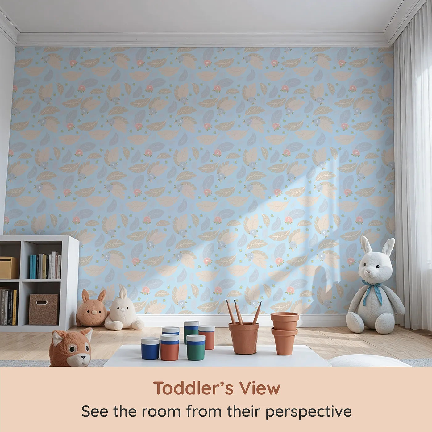 Whimsy Tots Whispering Petal Leaves Wallpaper in Sky Blue (W3131D) from your child's view.Floating florals and soft leaves drift on a pale blue breeze.