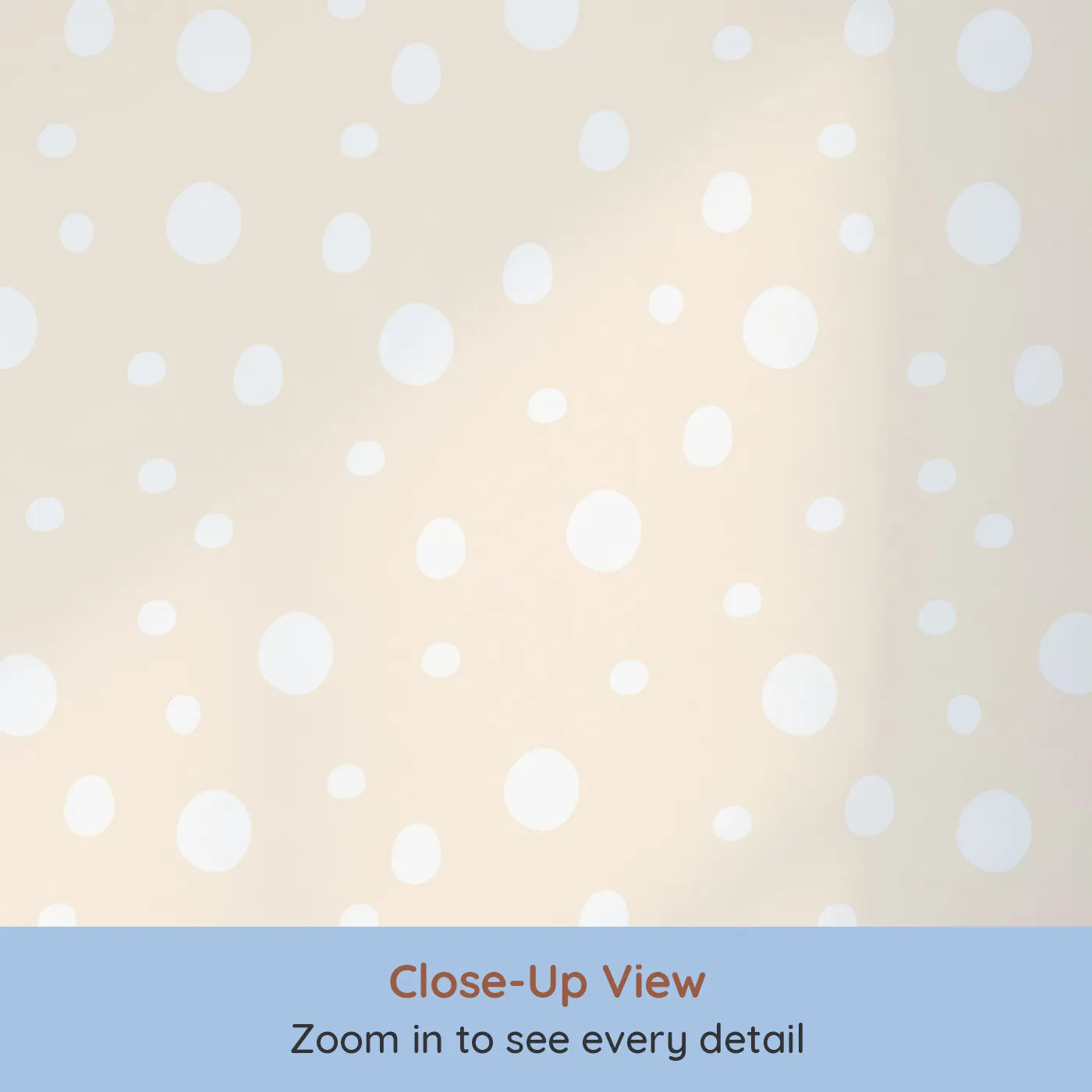 Close-up view of Whimsy Tots' Gentle Pebble Dots Wallpaper in Butter Beige (W3136B).Soft white dots scatter like pebbles on a buttery beige field.