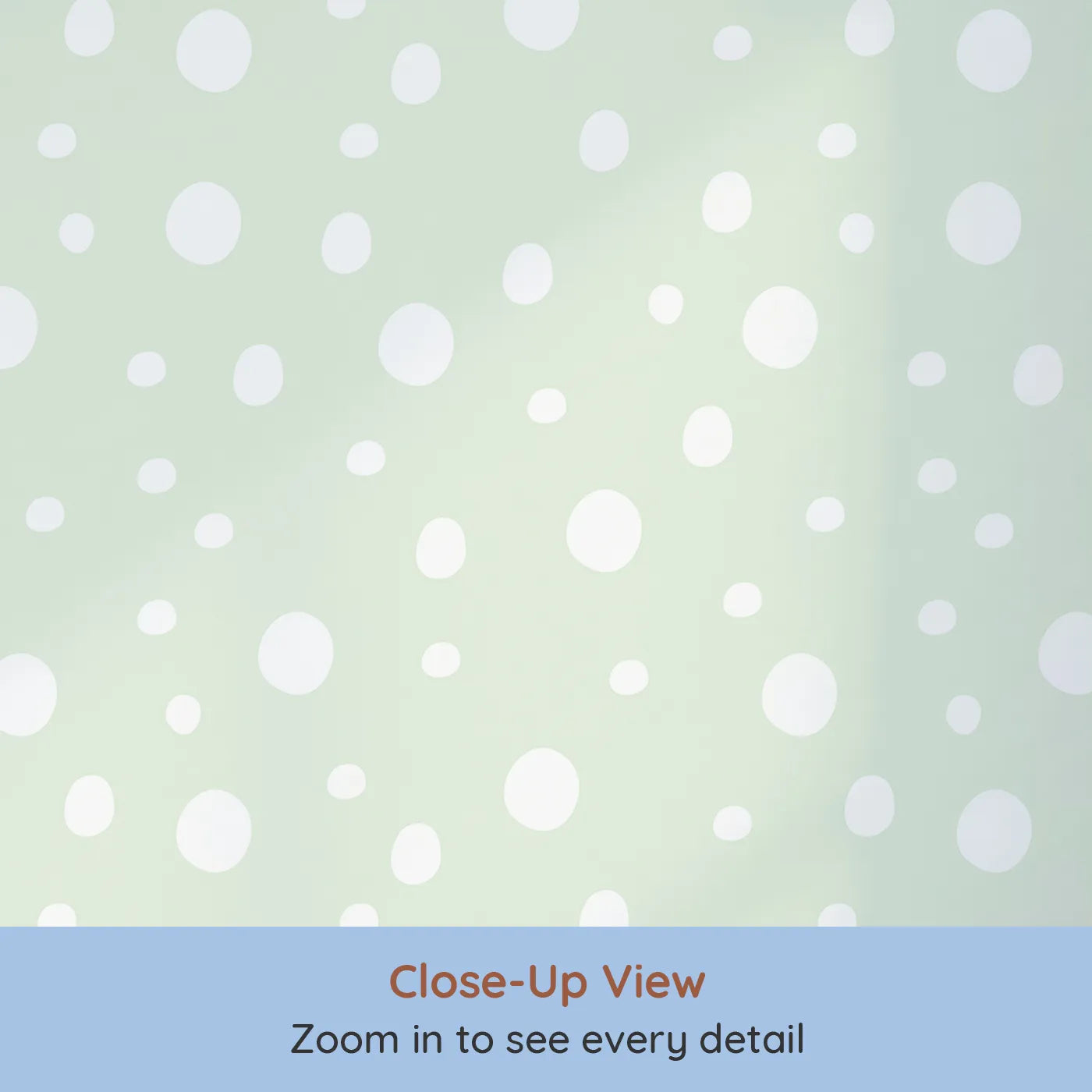 Close-up view of Whimsy Tots' Gentle Pebble Dots Wallpaper in Mint Cream (W3136C).Soft white pebbles dance across a gentle mint field.