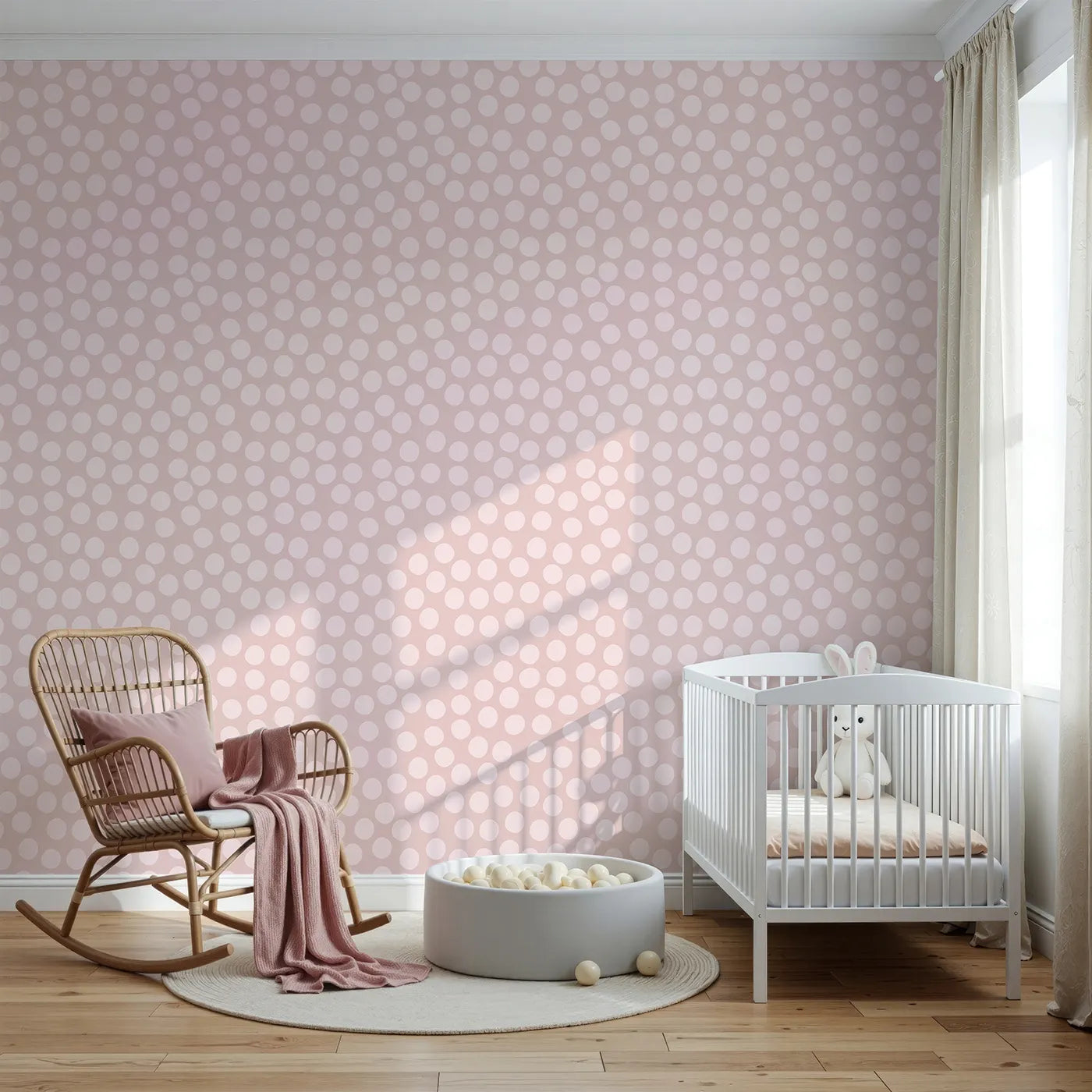 Front view of Whimsy Tots' Playful Pebble Dots Wallpaper in Blush Pink