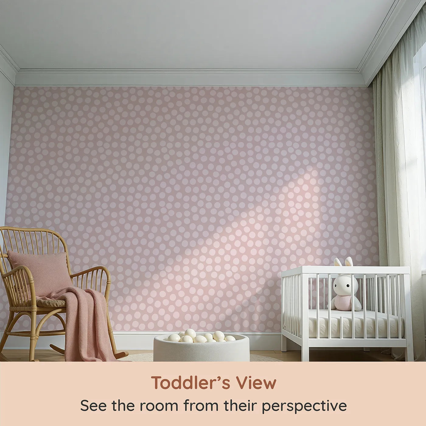 Whimsy Tots Playful Pebble Dots Wallpaper in Blush Pink (W3142A) from your child's view.Soft pink ovals create a cozy rhythm across a rosy blush field.