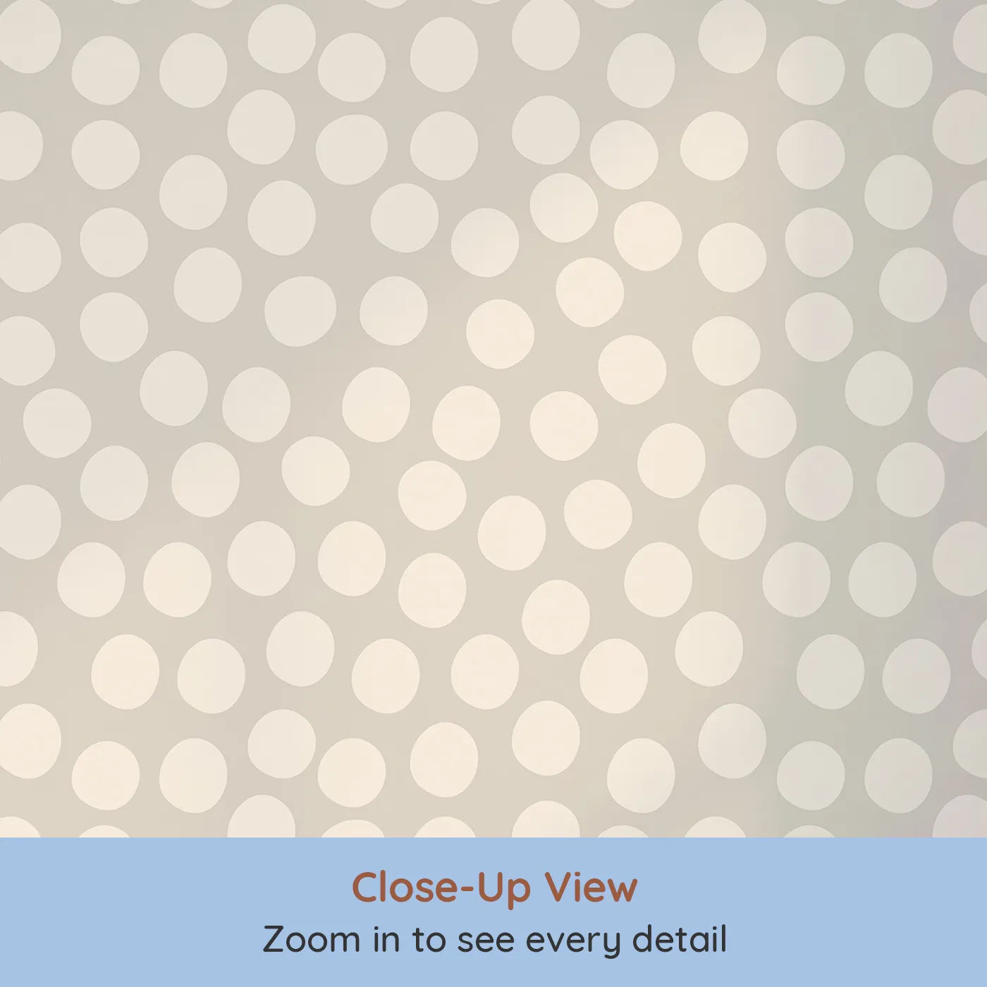 Close-up view of Whimsy Tots' Playful Pebble Dots Wallpaper in Oat Beige (W3142B).Creamy dots dot across a gentle oat-colored canvas.