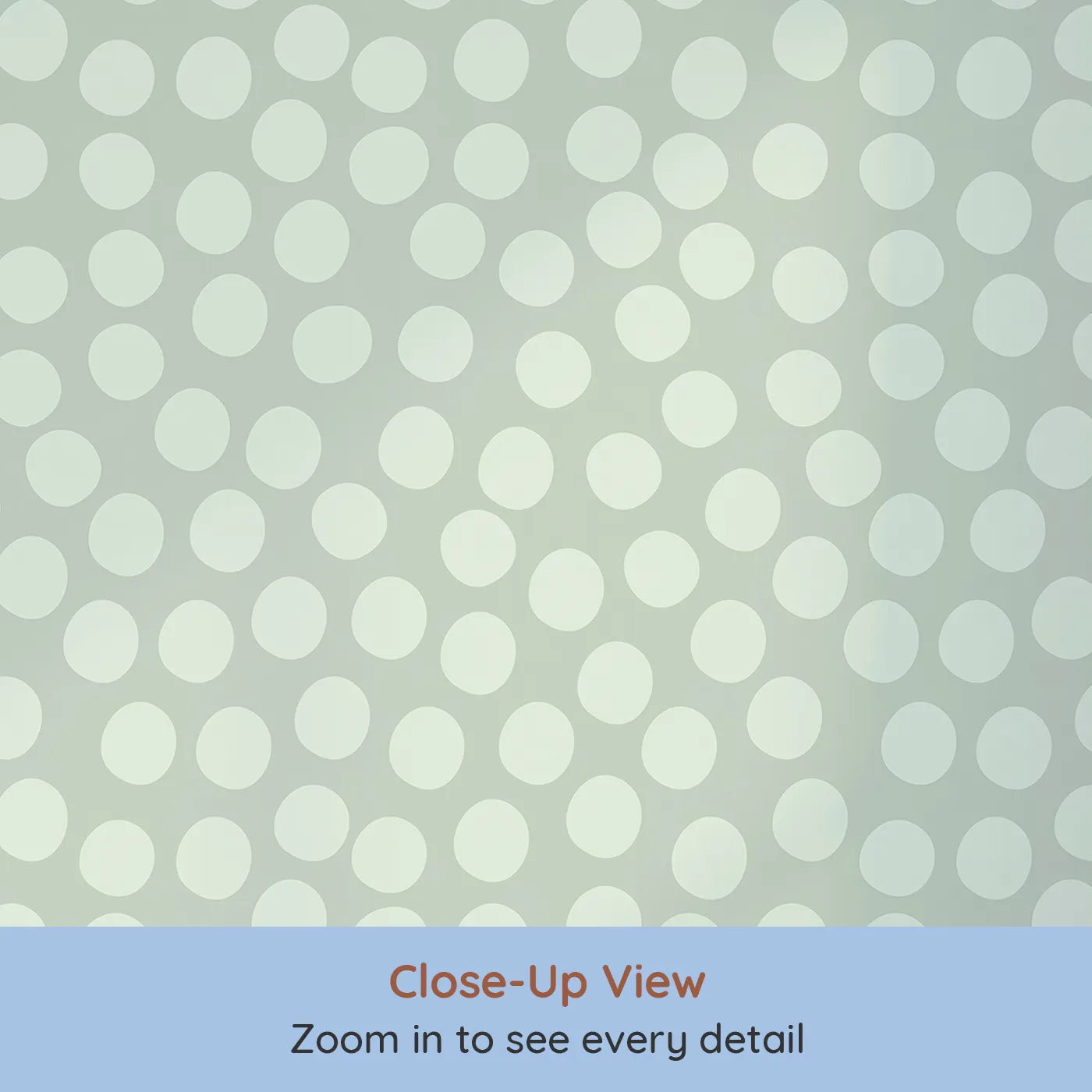 Close-up view of Whimsy Tots' Playful Pebble Dots Wallpaper in Sage Green (W3142C).Soft sage ovals ripple gently across a meadow-toned canvas.