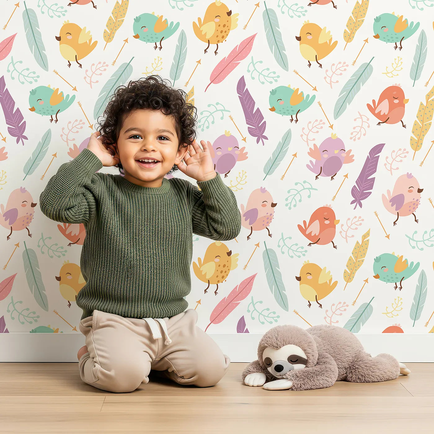 Lovely child standing in front of Whimsy Tots Feathered Joy Parade Wallpaper in Cream White with bird, feather, arrow, sprig in design.