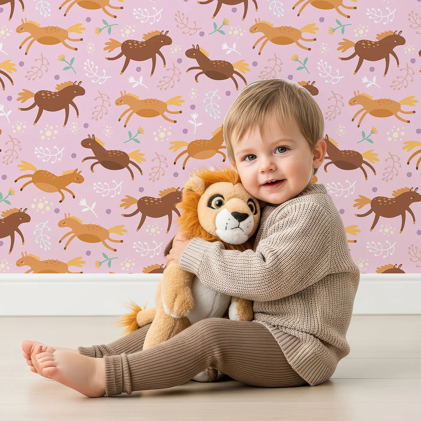 Lovely child standing in front of Whimsy Tots Dreamy Pony Meadow Wallpaper in Blush Pink with horse, flower, leaf, dot in design.