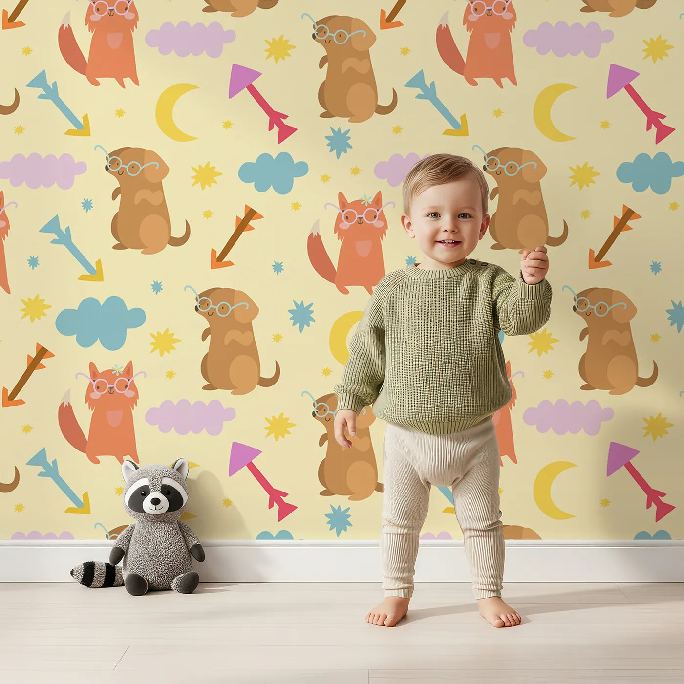 Lovely child standing in front of Whimsy Tots Arrow Pup and Foxy Night Parade Wallpaper in Dandelion with dog, fox, moon, arrow, star, cloud in design.