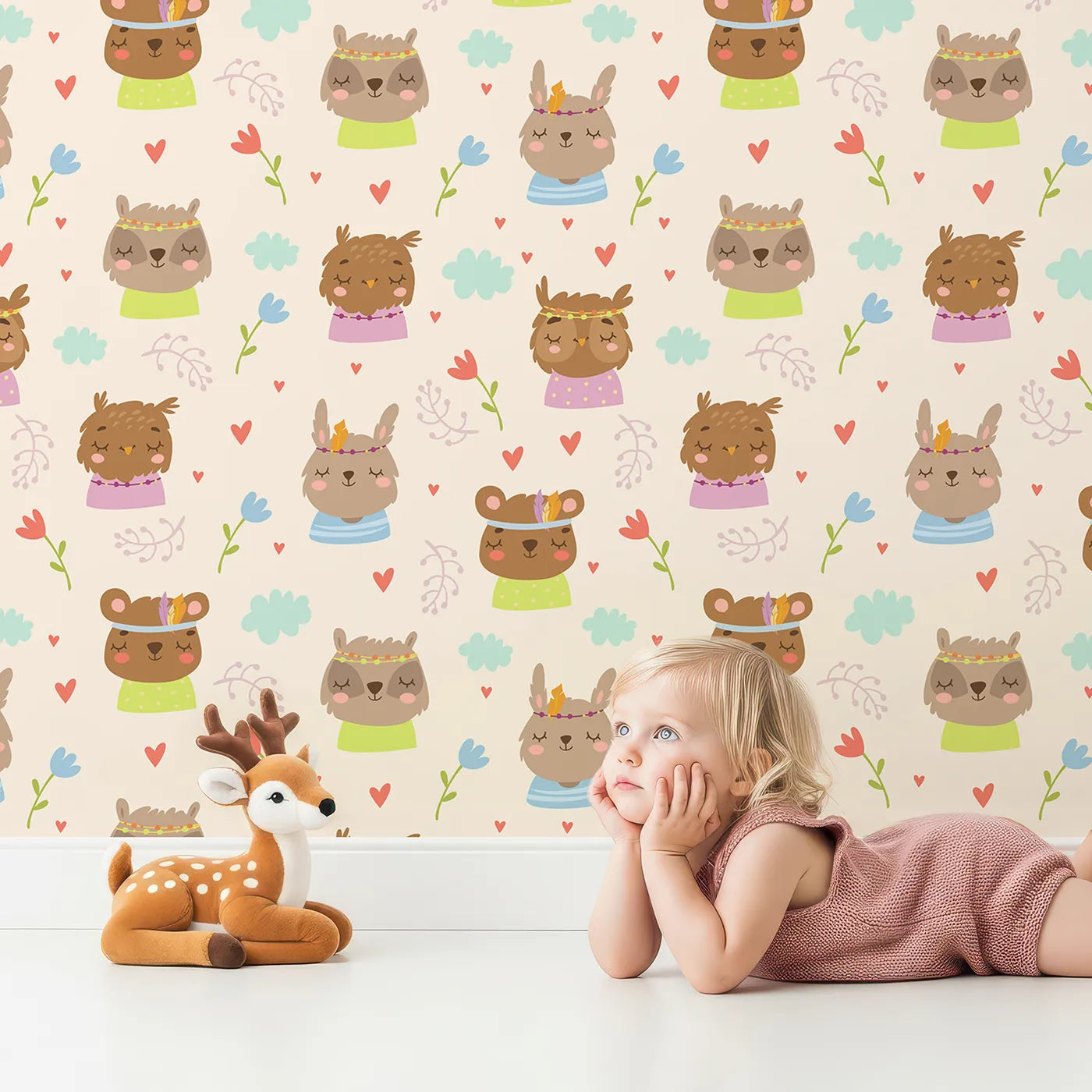 Lovely child standing in front of Whimsy Tots Heart Bloom Critters Wallpaper in Cream with bear, rabbit, owl, heart, flower, cloud in design.