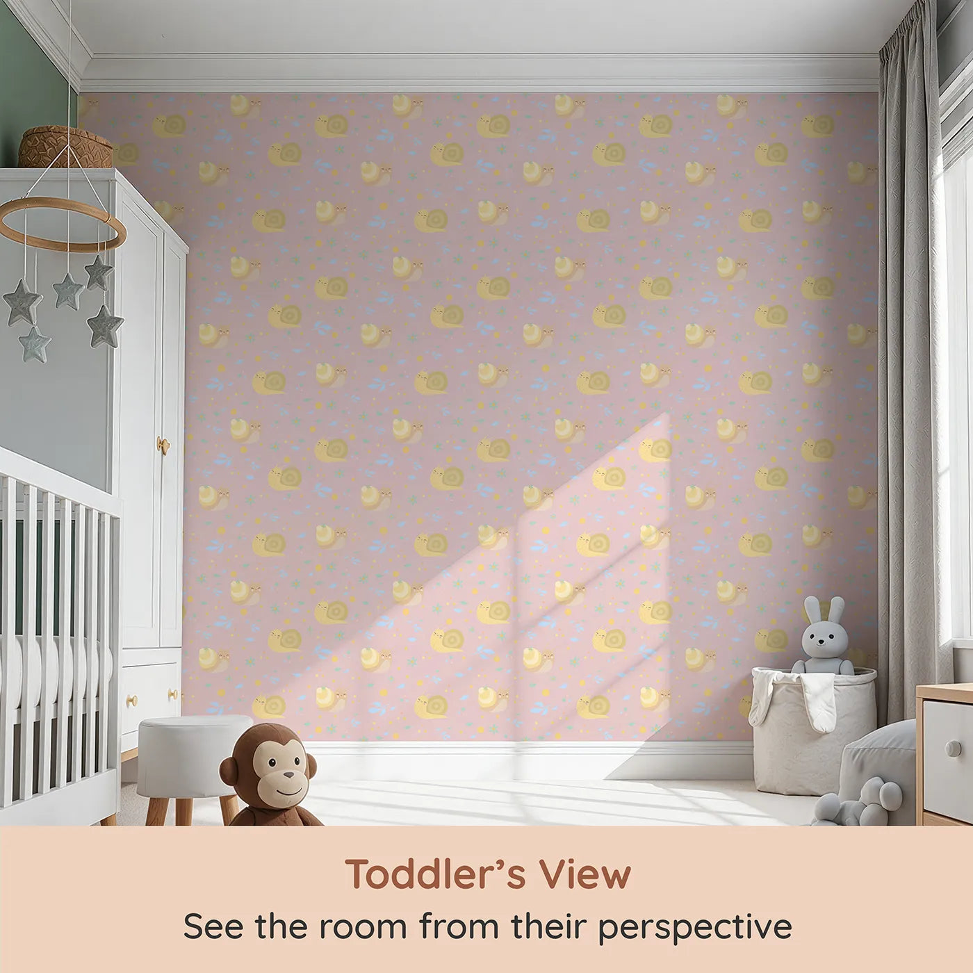 Whimsy Tots Snail Meadow Cuddle Parade Wallpaper in Blush Pink (W3170B) from your child's view.Smiling snails and pastel petals drift across a gentle blush sky.