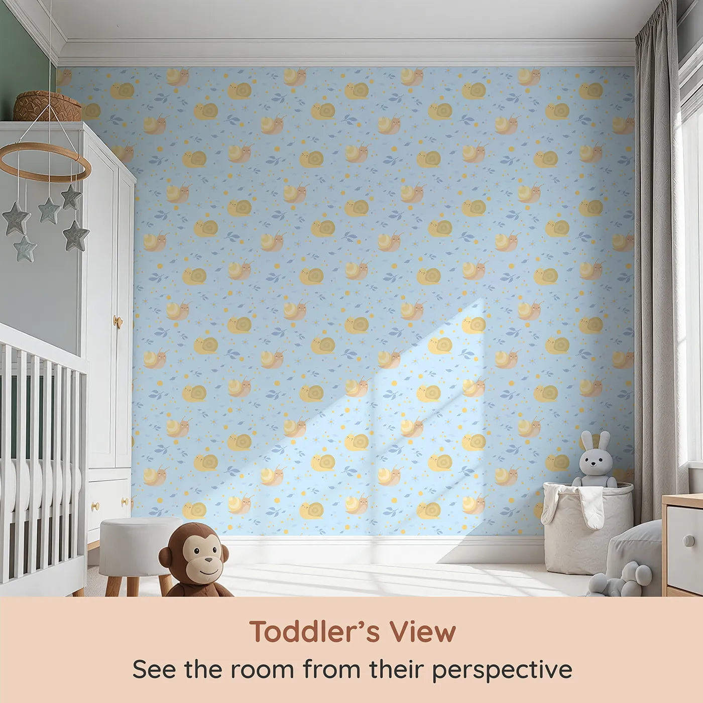 Whimsy Tots Snail Meadow Cuddle Parade Wallpaper in Sky Blue (W3170E) from your child's view.Cheerful snails float among flowers on a gentle blue breeze.