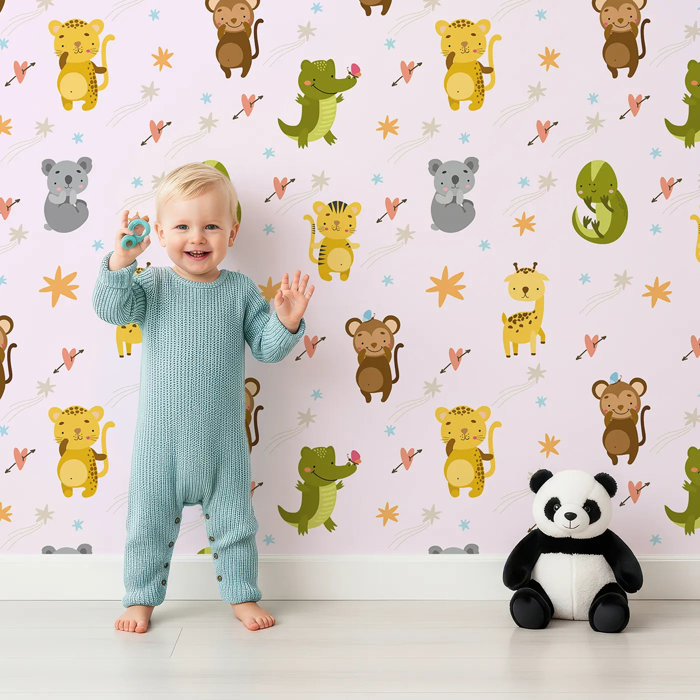 Lovely child standing in front of Whimsy Tots Wild Heart Animal Parade Wallpaper in Soft Lilac Lavender with giraffe, koala, leopard, monkey, tiger, crocodile, heart, arrow, star in design.