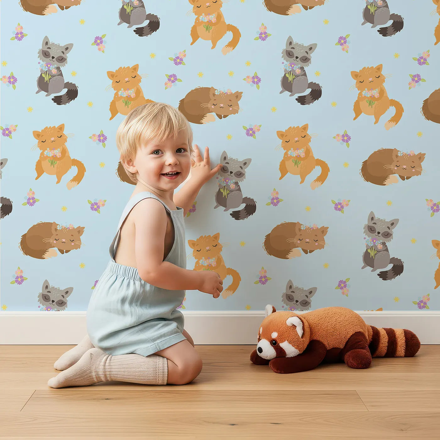 Lovely child standing in front of Whimsy Tots Blossom Fox Nap Parade Wallpaper in Sky Blue with fox, flower, star in design.