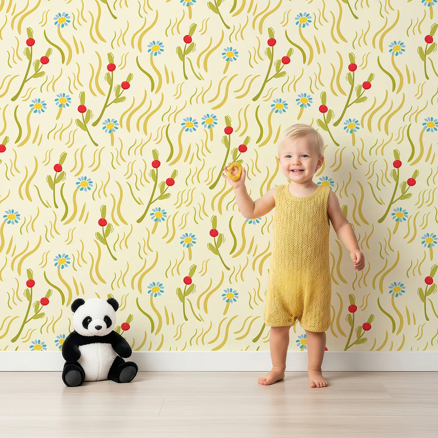 Lovely child standing in front of Whimsy Tots Breezy Meadow Daisies Wallpaper in Cream with flower, grass, berry, daisy in design.