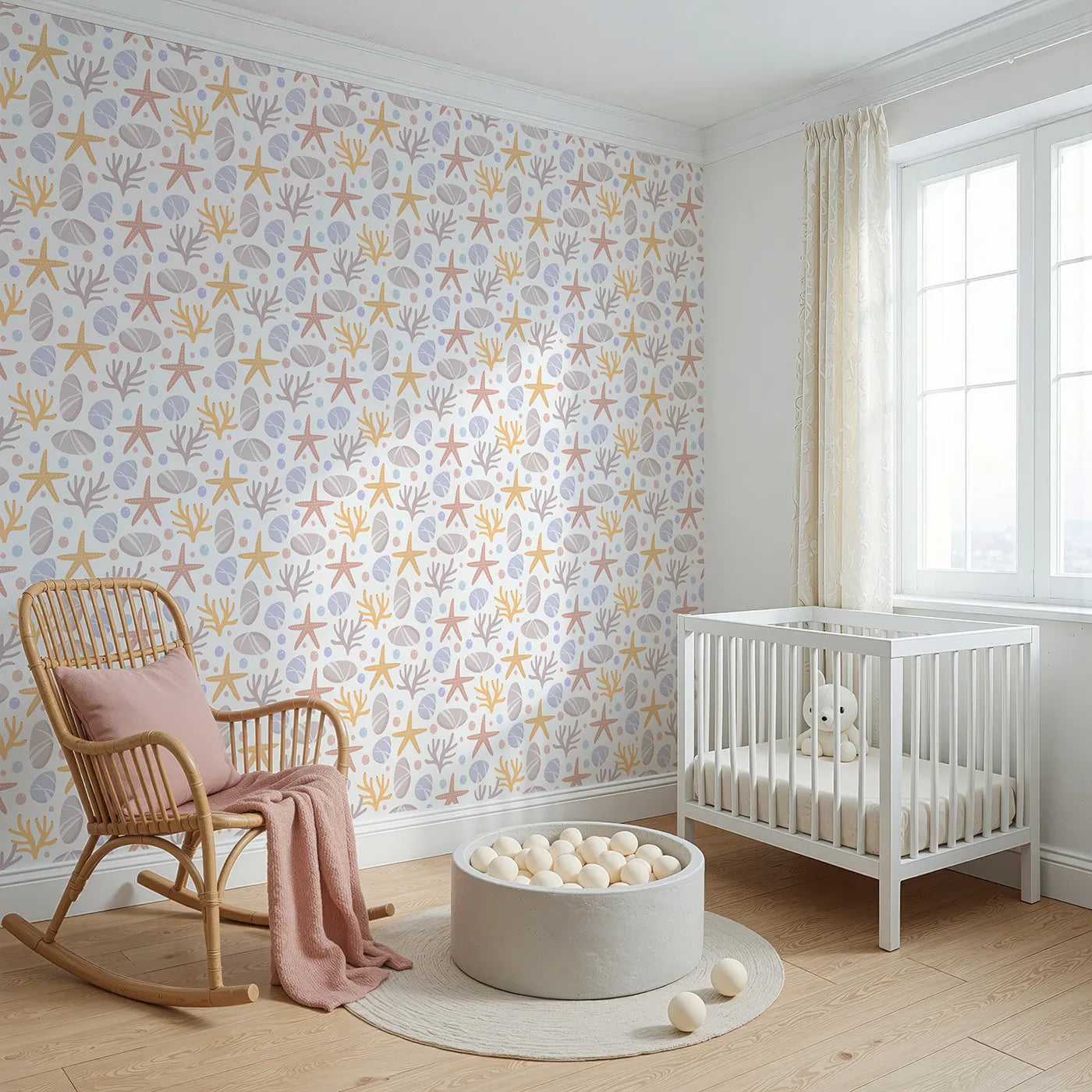 Angled view of Whimsy Tots' Pebble Shoreline Calm Wallpaper in White (W3192A).Gentle stones, starfish, and coral float across a quiet seaside breeze.