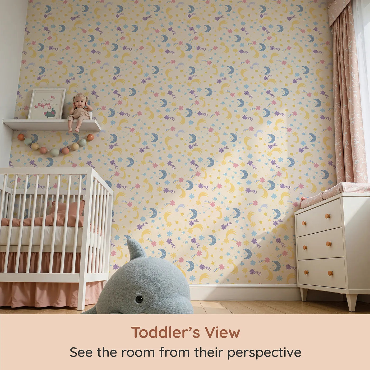 Whimsy Tots Starlit Wishes Wallpaper in Vanilla (W3195B) from your child's view.Moons, constellations, and twinkling stars light up their nighttime wonderland.