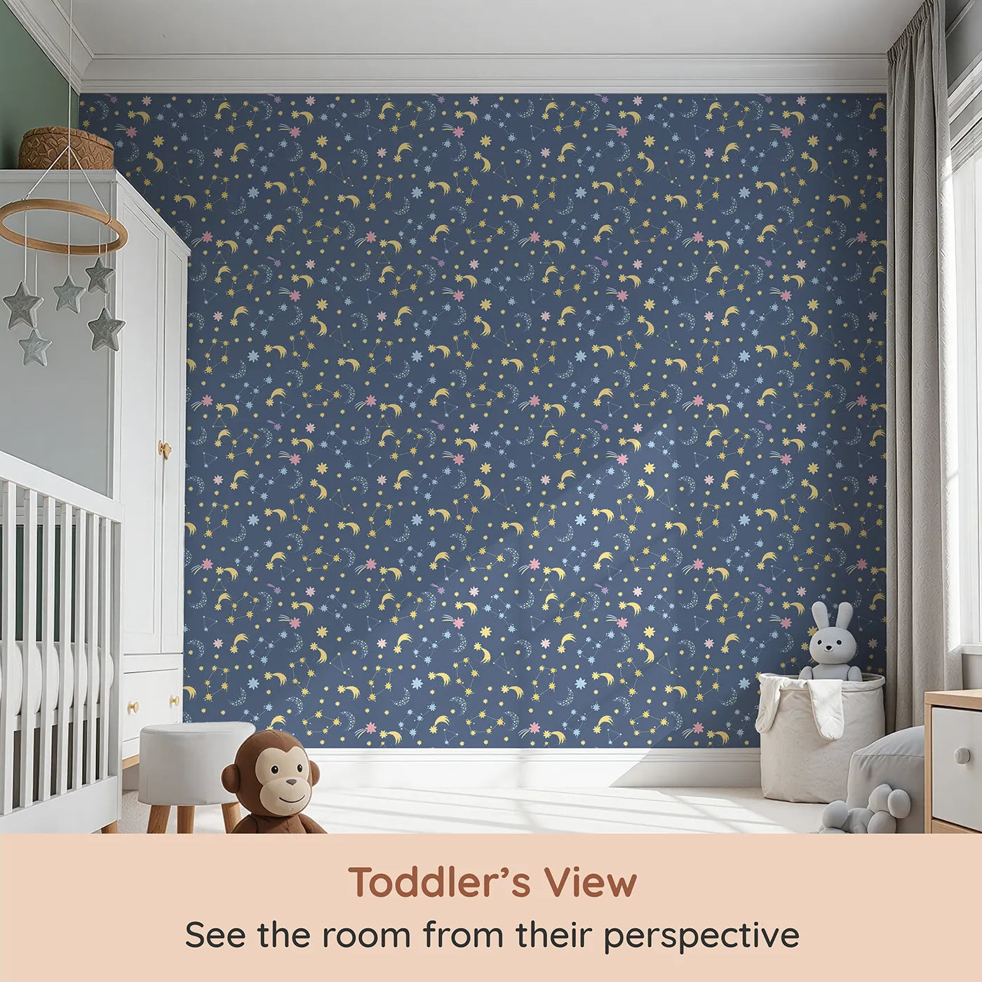 Whimsy Tots Starglow Constellation Dance Wallpaper in Navy Blue (W3198B) from your child's view.Moons, constellations, and glittering bursts swirl in a magical blue night.