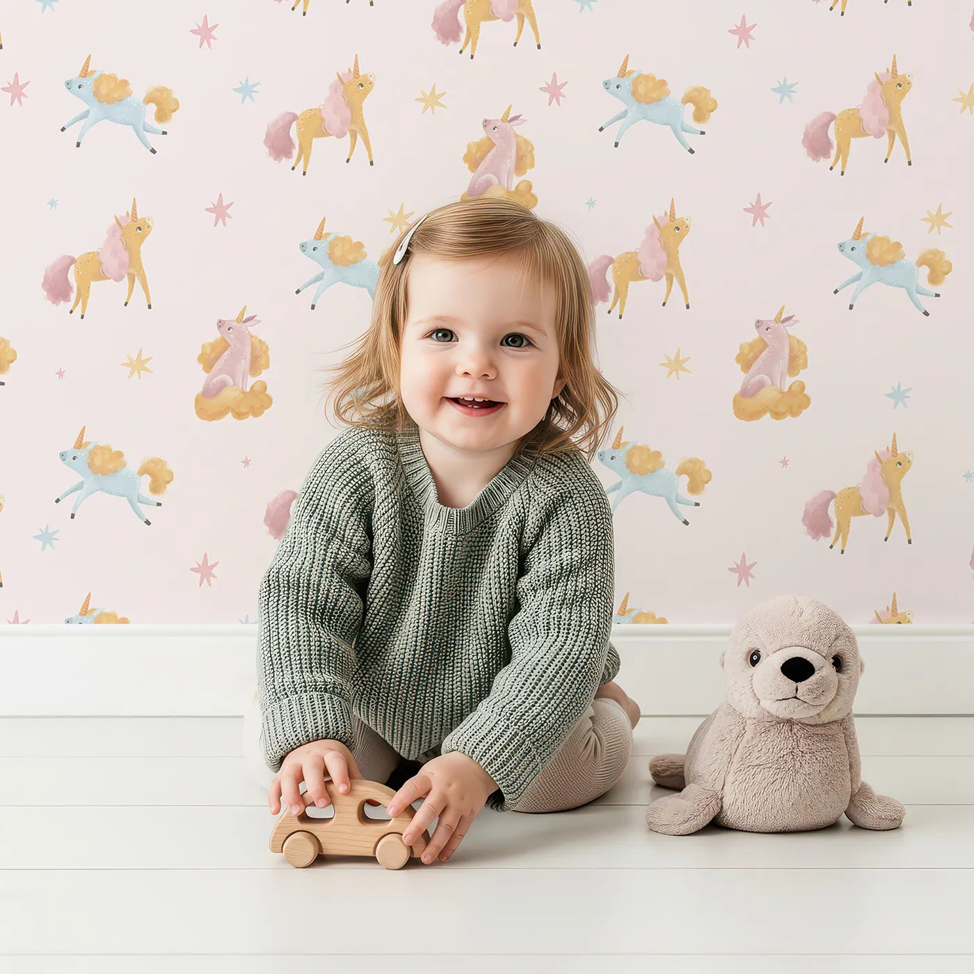 Lovely child standing in front of Whimsy Tots Magical Mane Friends Wallpaper with unicorn, cloud, star in design.