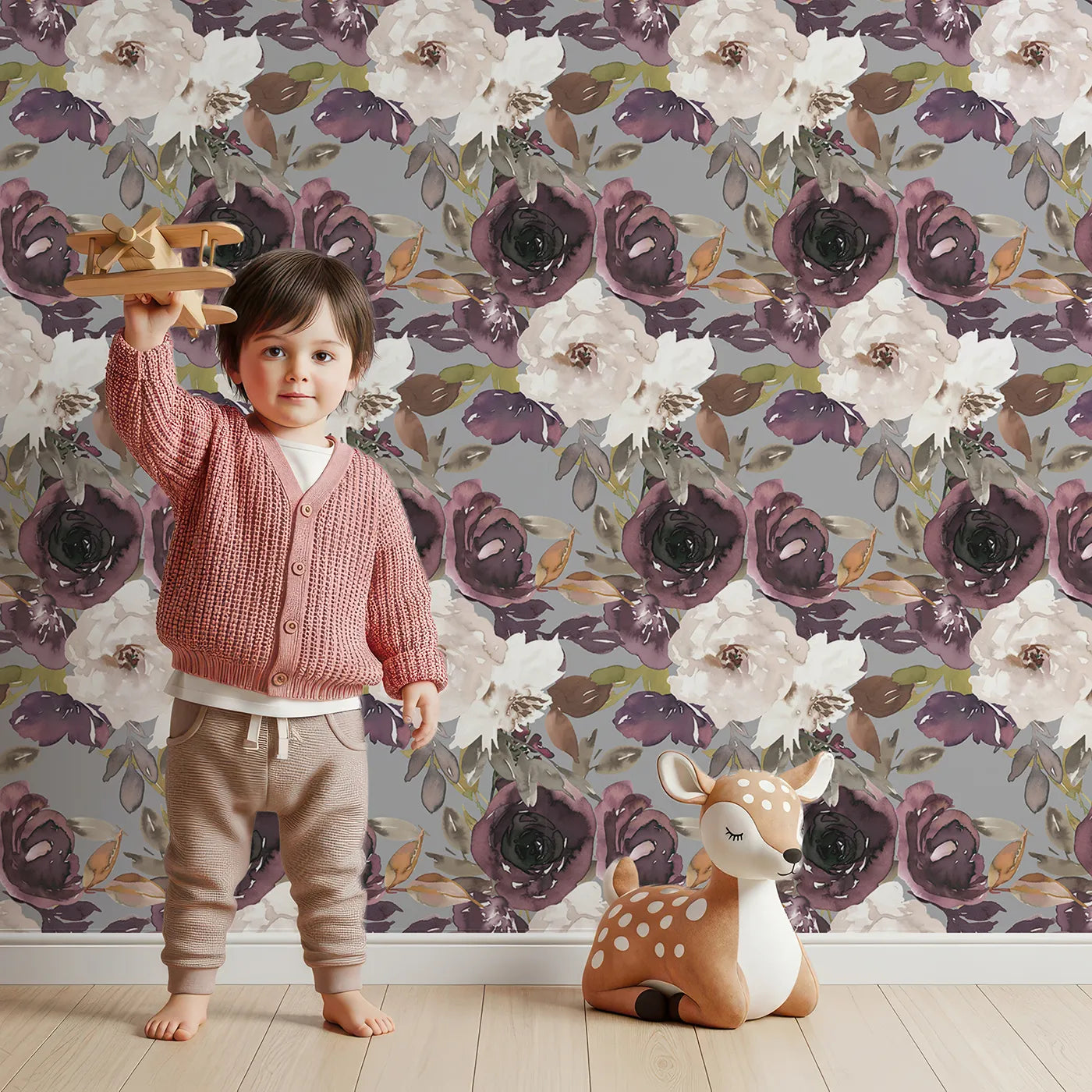 Lovely child standing in front of Whimsy Tots Moody Bloom Symphony Wallpaper with flower, bloom, leaf in design.