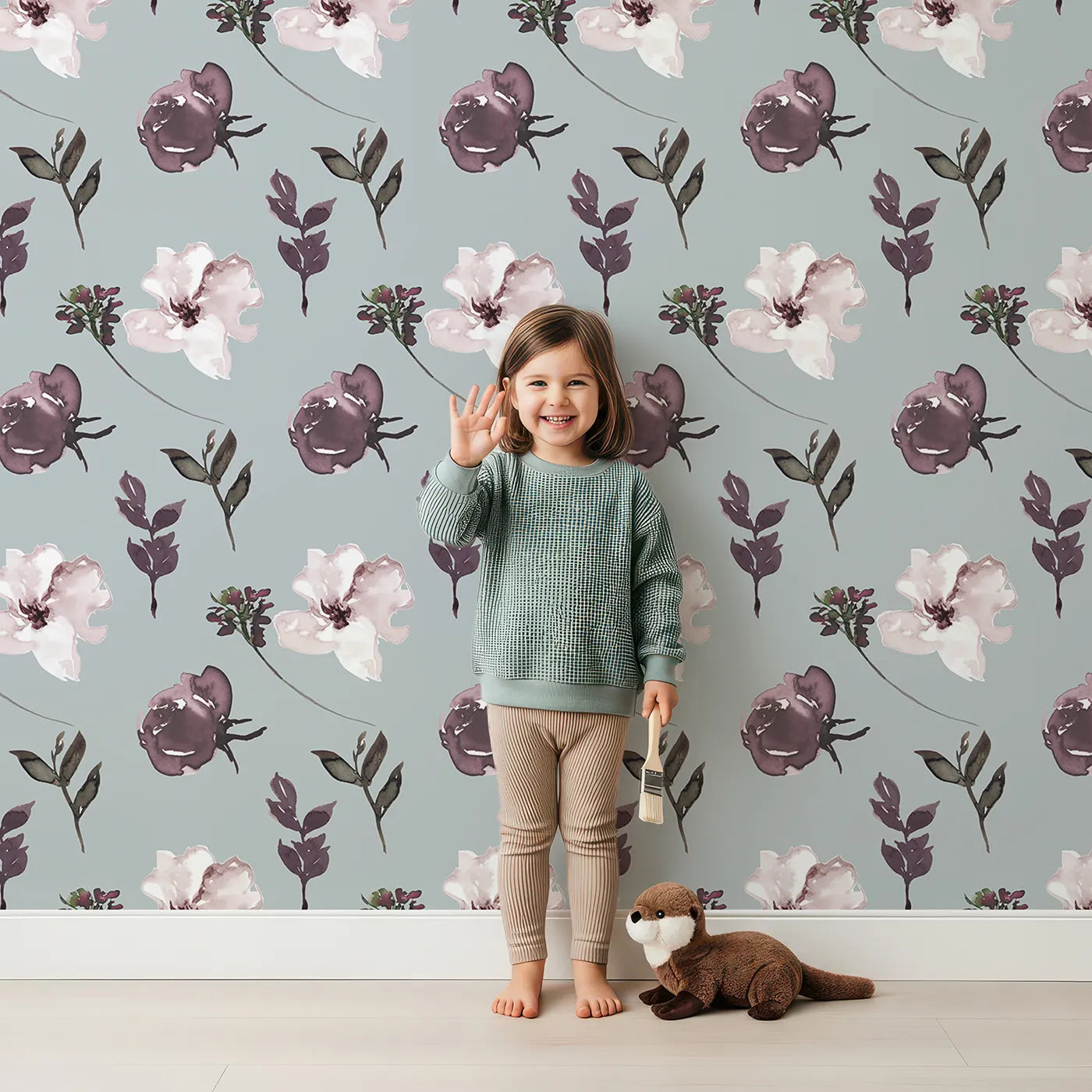 Lovely child standing in front of Whimsy Tots Blushed Twilight Garden Wallpaper with flower, petal, leaf, stem in design.