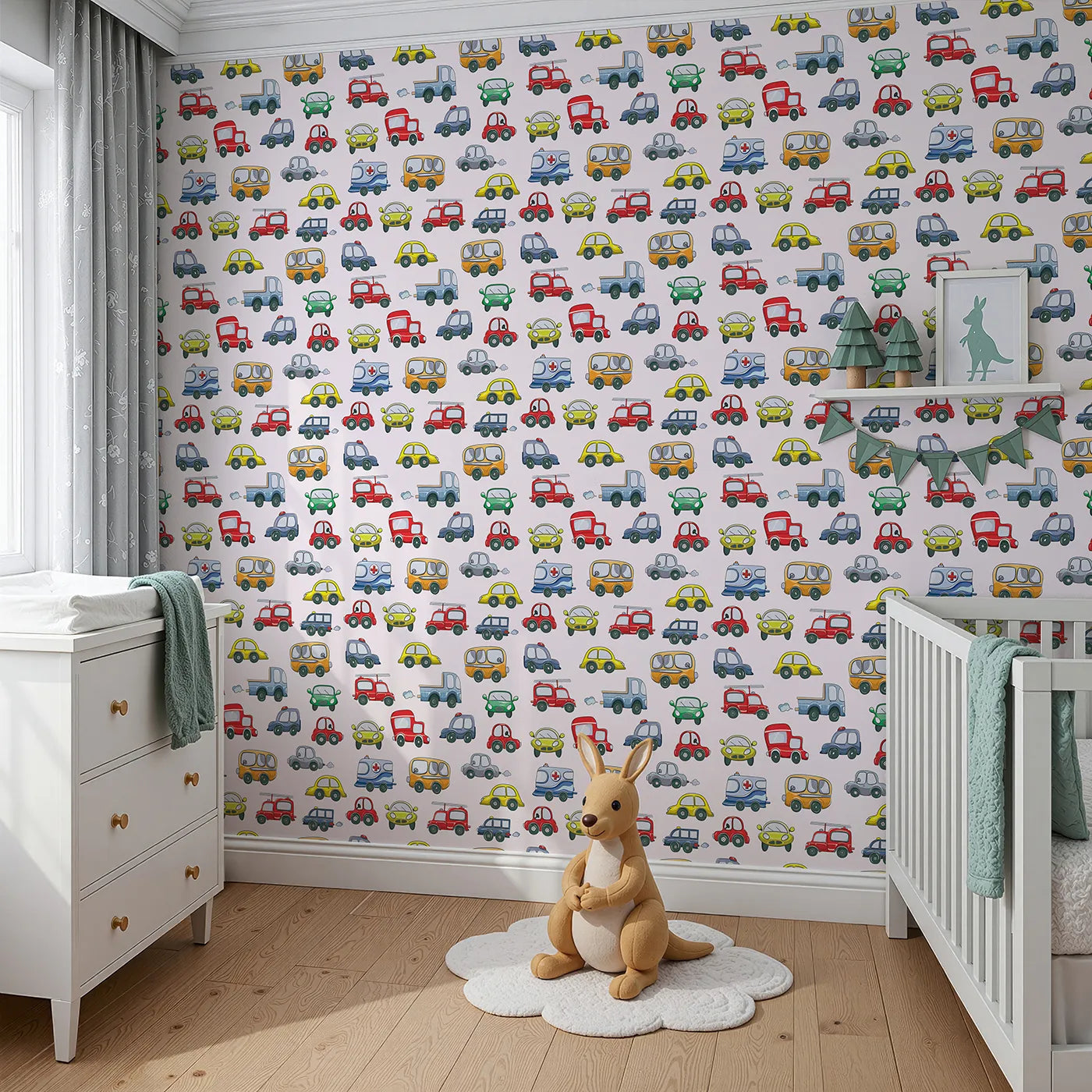 Angled view of Whimsy Tots' Tiny Wheels Parade Wallpaper in Soft Pink (W3224B).Cheerful cars cruise across a sweet soft-pink sky.