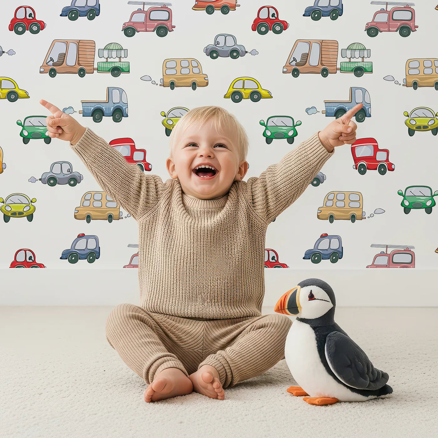Lovely child standing in front of Whimsy Tots Bumper Buddies Rally Wallpaper in White with car, truck, bus, foodtruck, taxi in design.