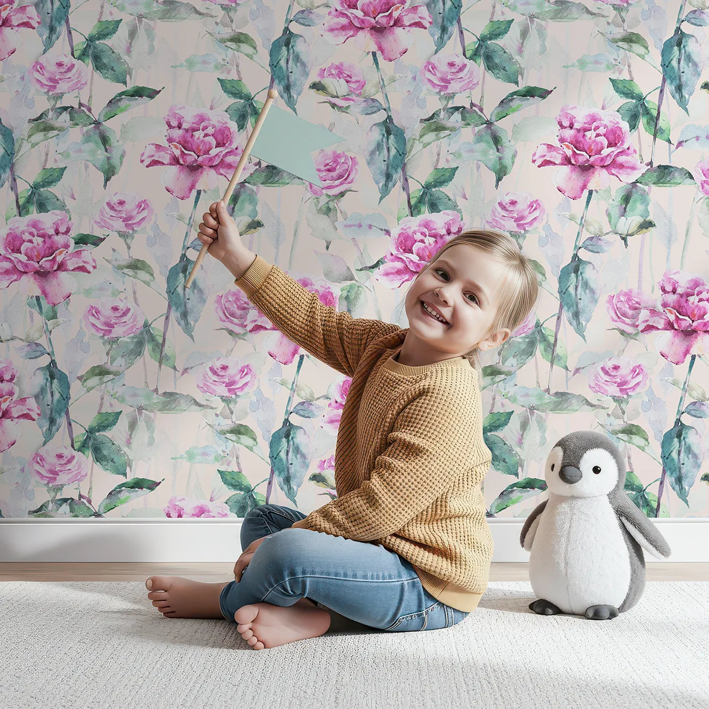 Lovely child standing in front of Whimsy Tots Rosy Garden Stroll Wallpaper in Cream with rose, flower, leaf, garden in design.