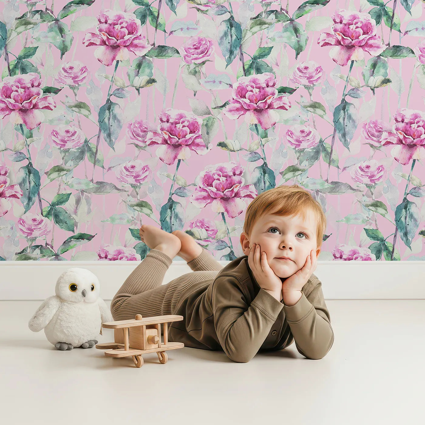 Lovely child standing in front of Whimsy Tots Rosy Garden Stroll Wallpaper in Pink with rose, flower, stem, pink in design.