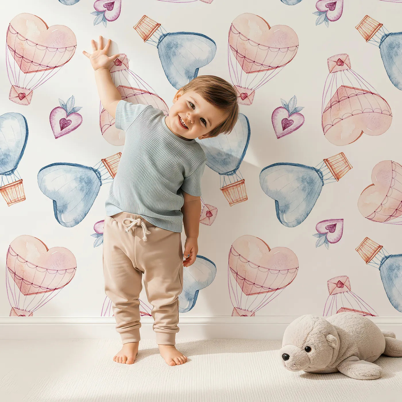 Lovely child standing in front of Whimsy Tots Heart Balloon Adventure Wallpaper with balloon, heart, envelope, letter, sky in design.