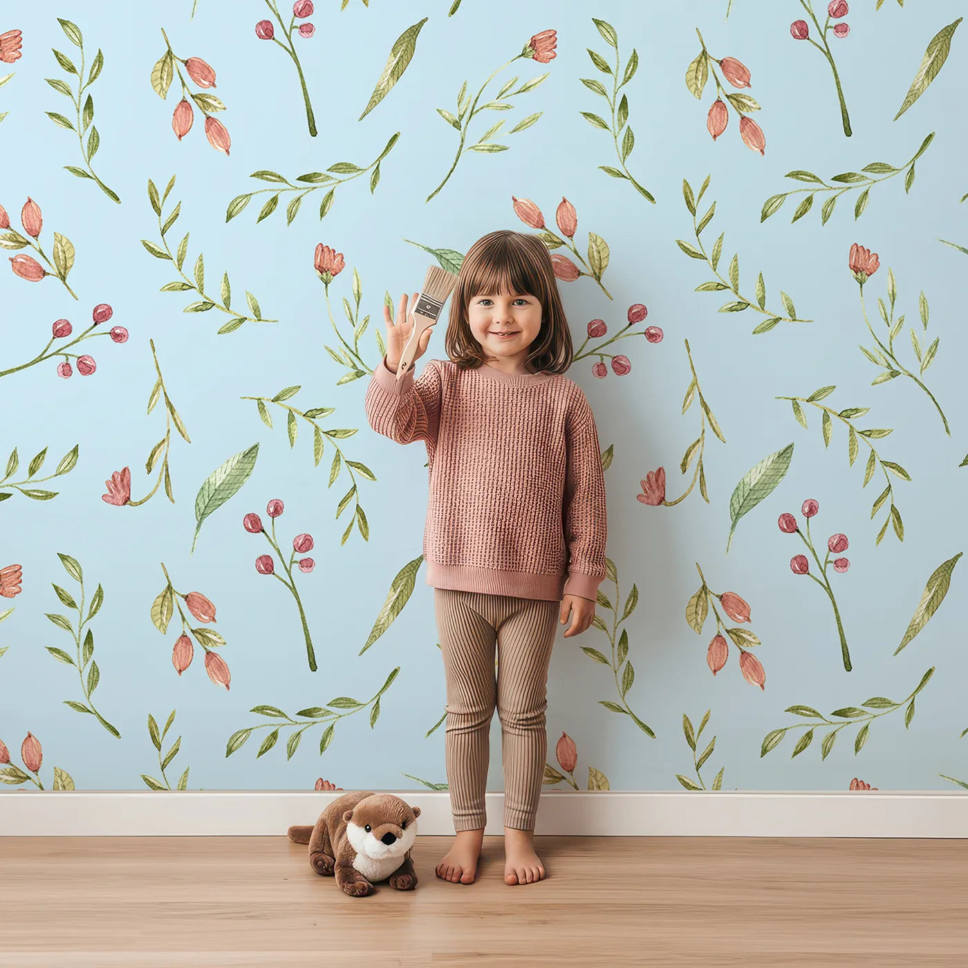 Lovely child standing in front of Whimsy Tots Blossom Meadow Breeze Wallpaper in Sky Blue with flower, leaf, vine, berry in design.