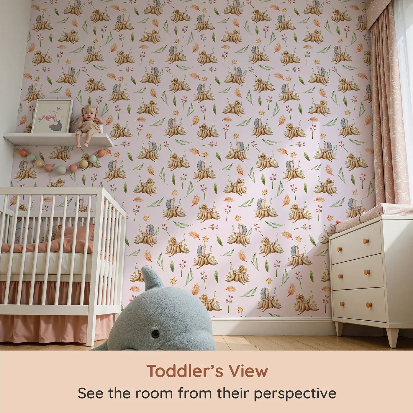 Whimsy Tots Forest Stump Snuggle Wallpaper in Blush Pink (W3251B) from your child's view.Snails and hedgehogs perch on tree stumps, wrapped in autumn leaves and soft forest light.